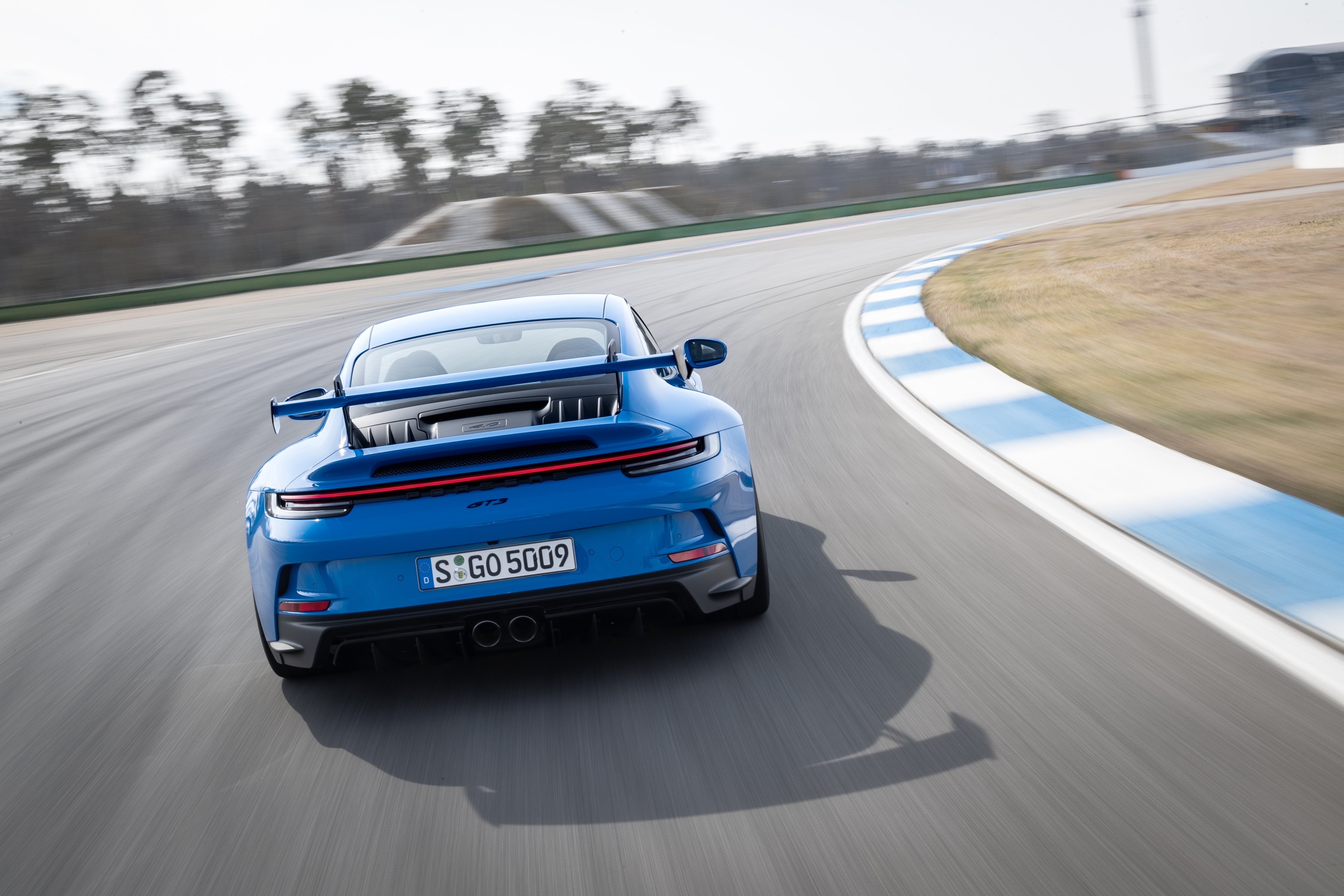 Blue Porsche 911 GT3 on a race track HD Wallpaper
