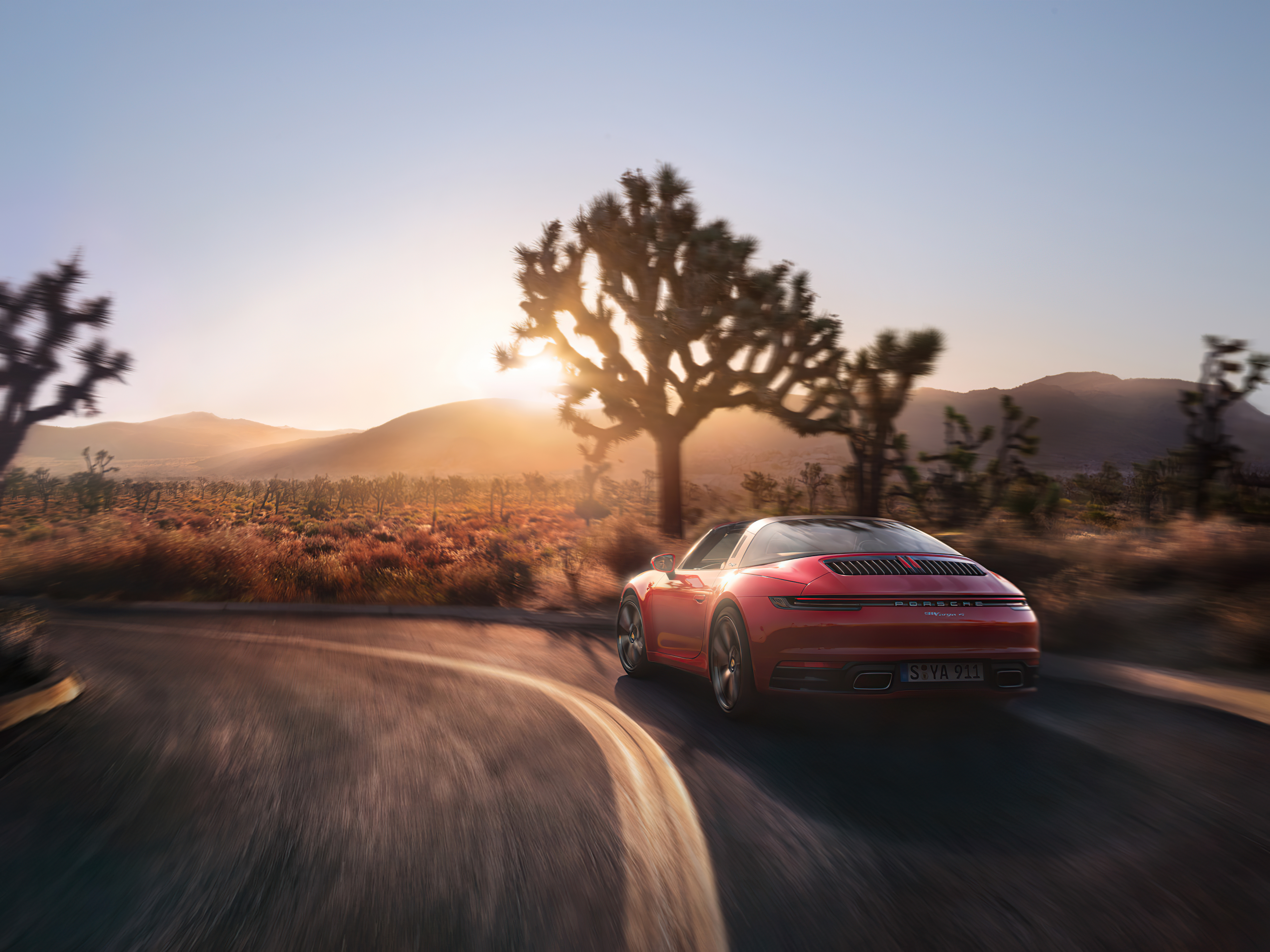 Red Porsche 911 Targa driving in desert at sunset HD Wallpaper