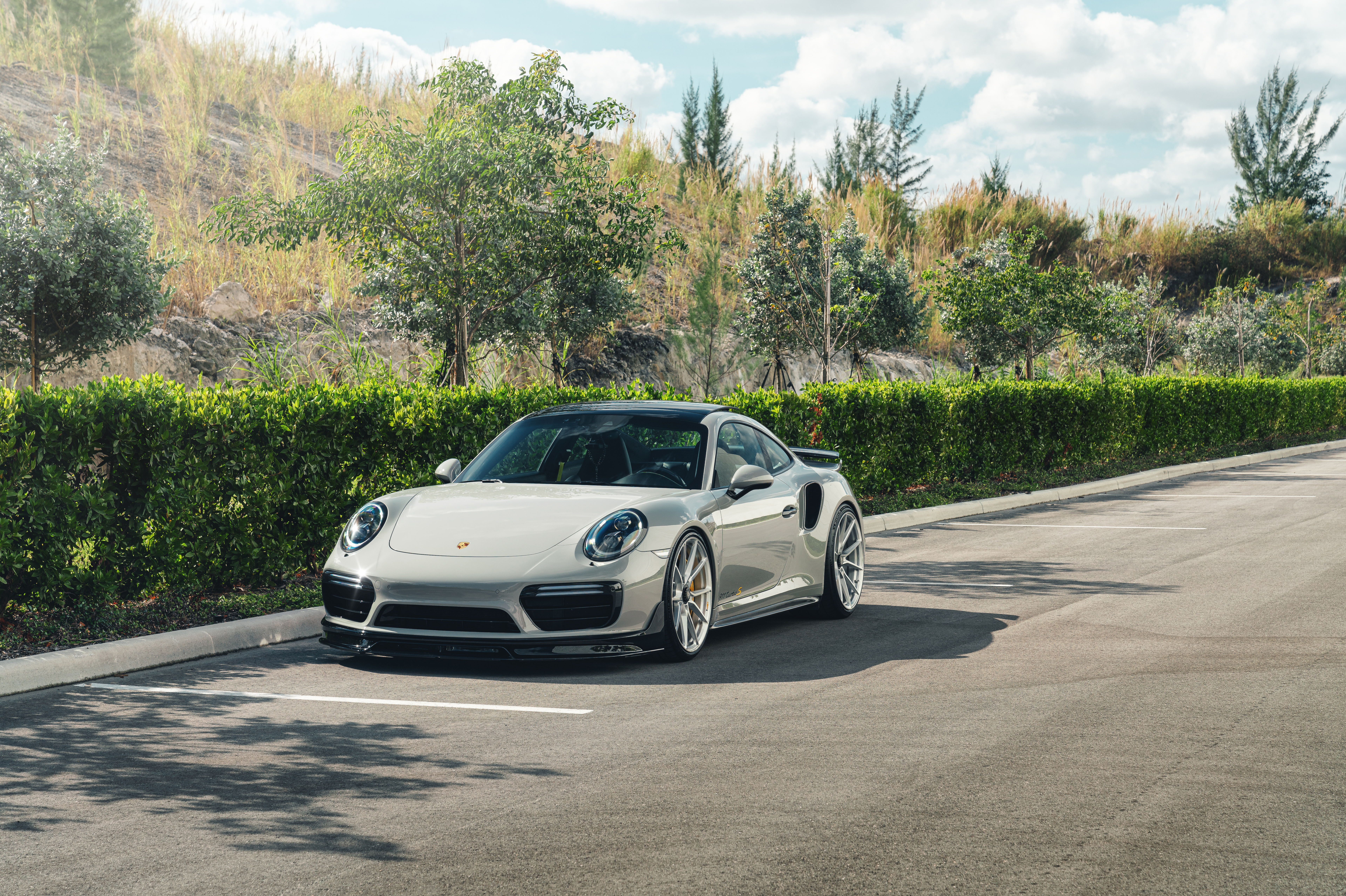 Porsche 911 Turbo S parked on asphalt HD Wallpaper