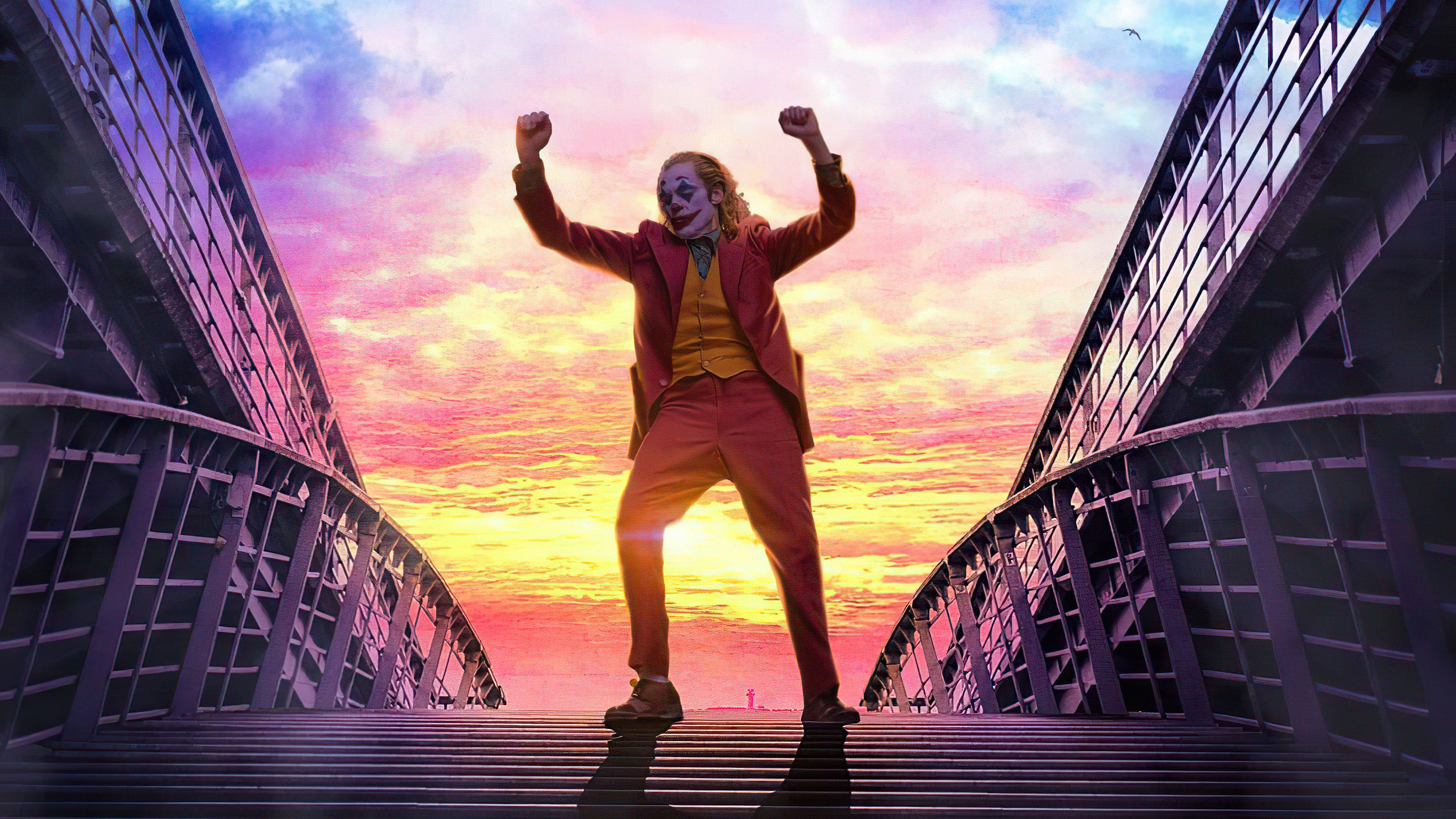 Joker dancing on a bridge at sunset HD Wallpaper