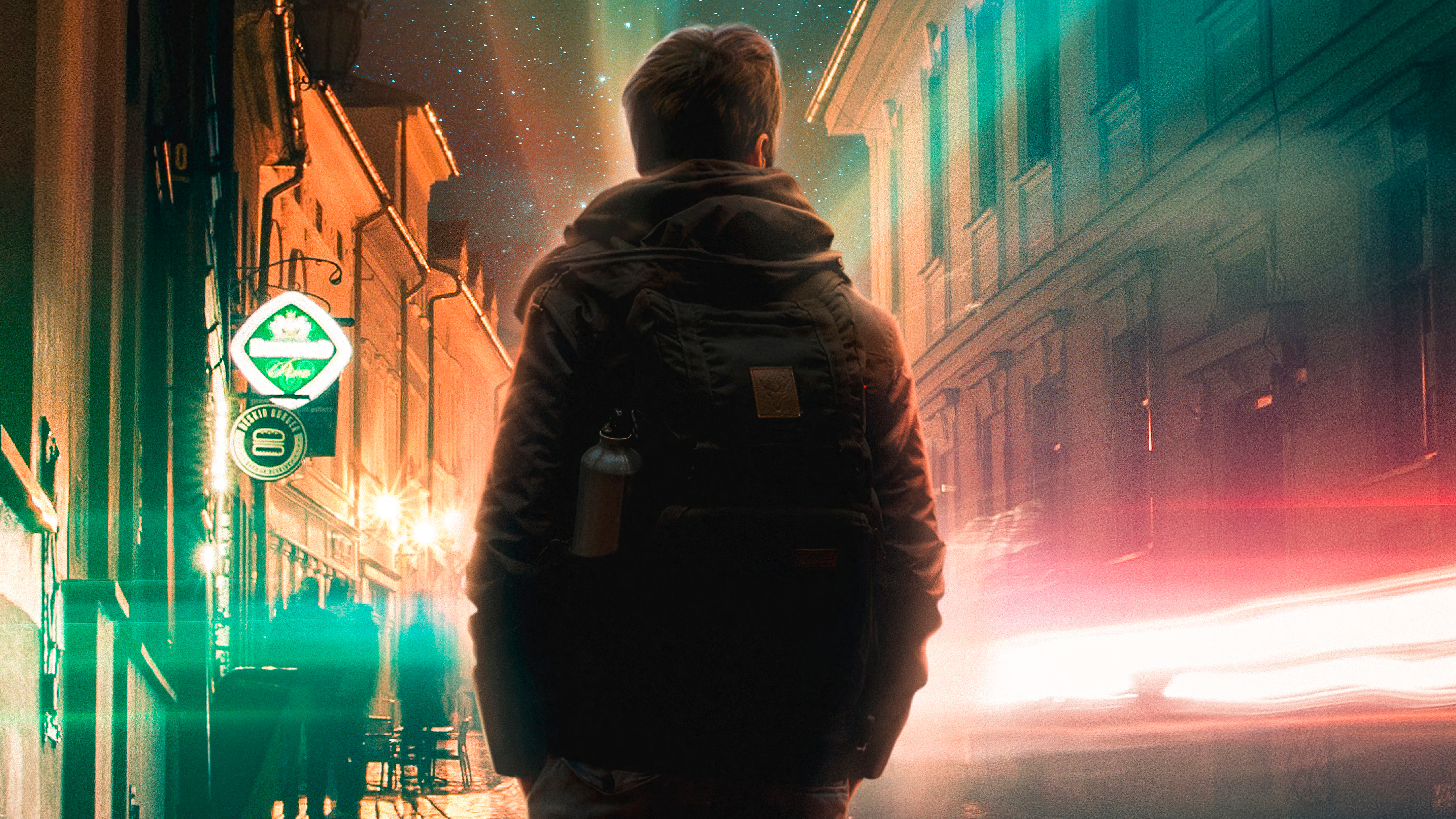 Man with backpack in a city at night HD Wallpaper