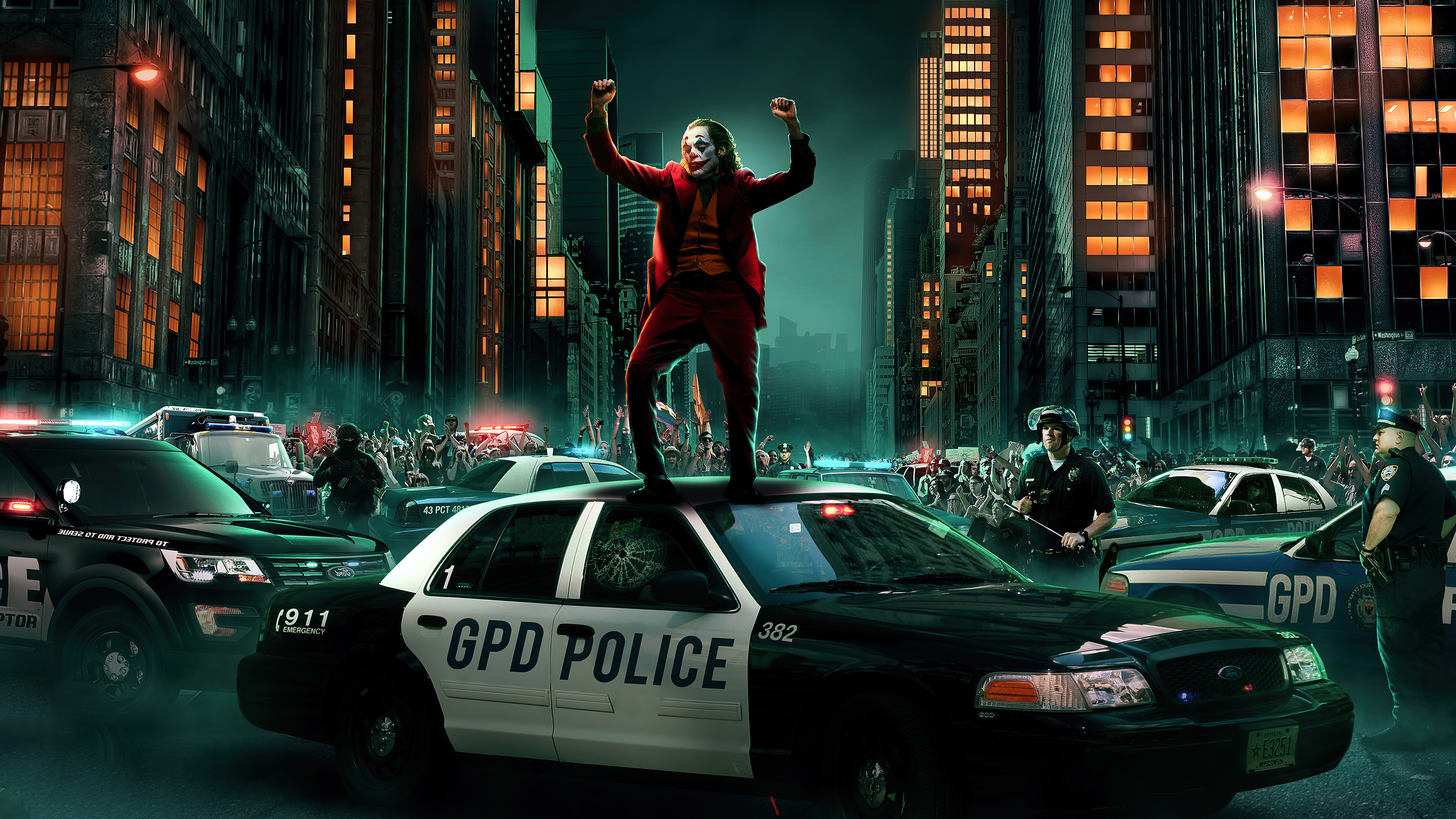 Joker standing on police car in city street HD Wallpaper