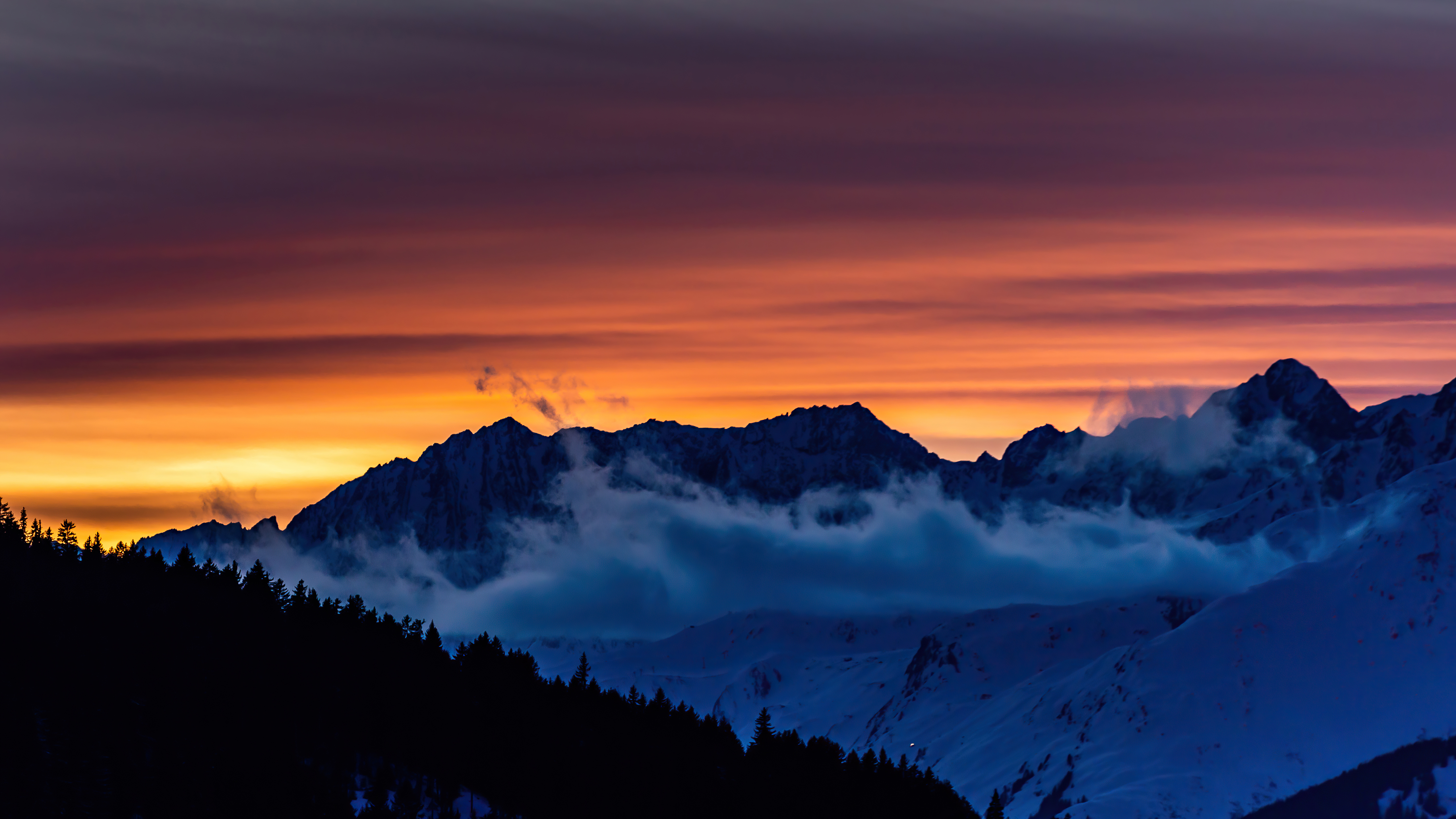 Sunset over snow-capped mountains with clouds HD Wallpaper