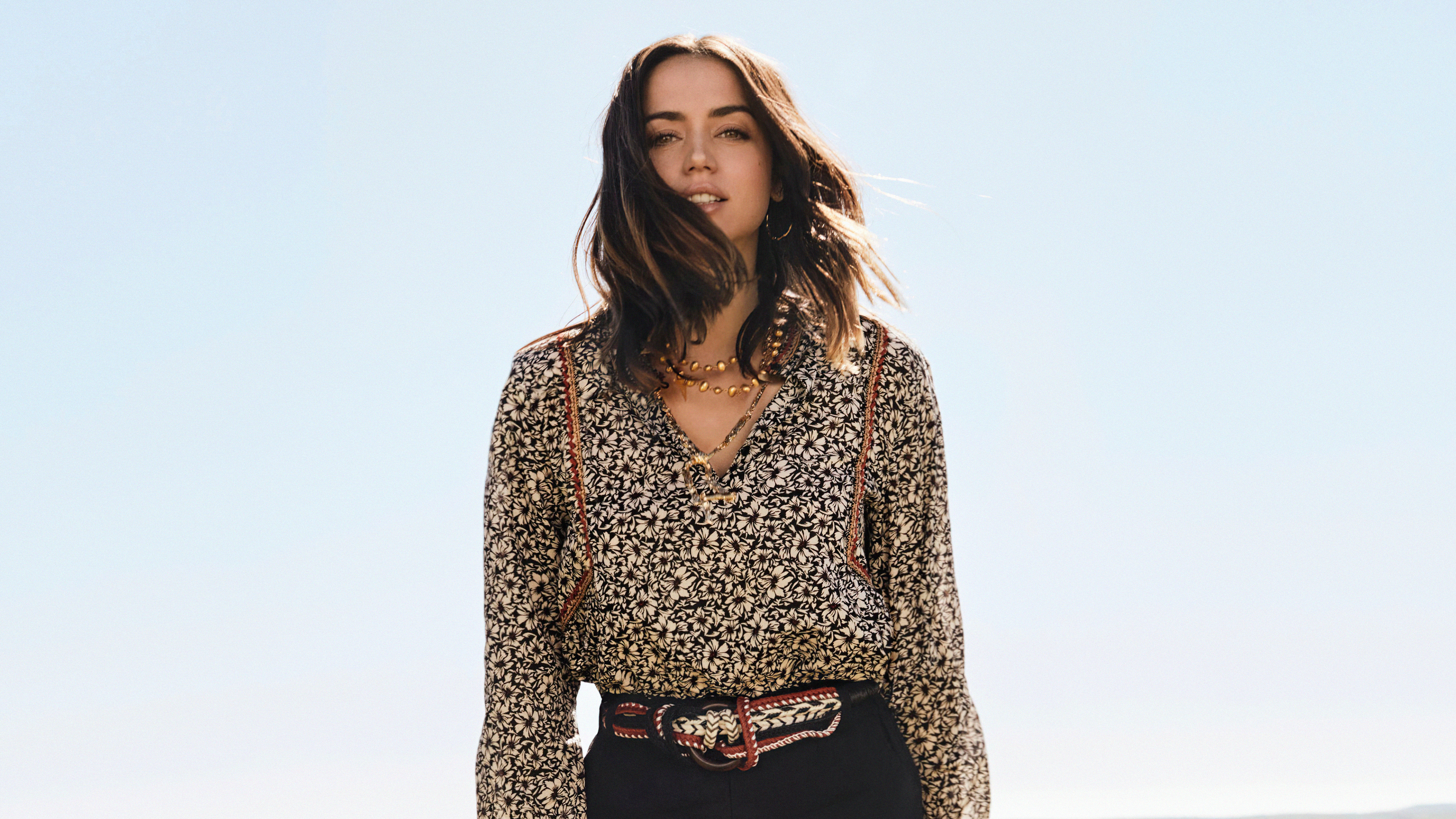 Ana de Armas in a floral shirt and black pants HD Wallpaper