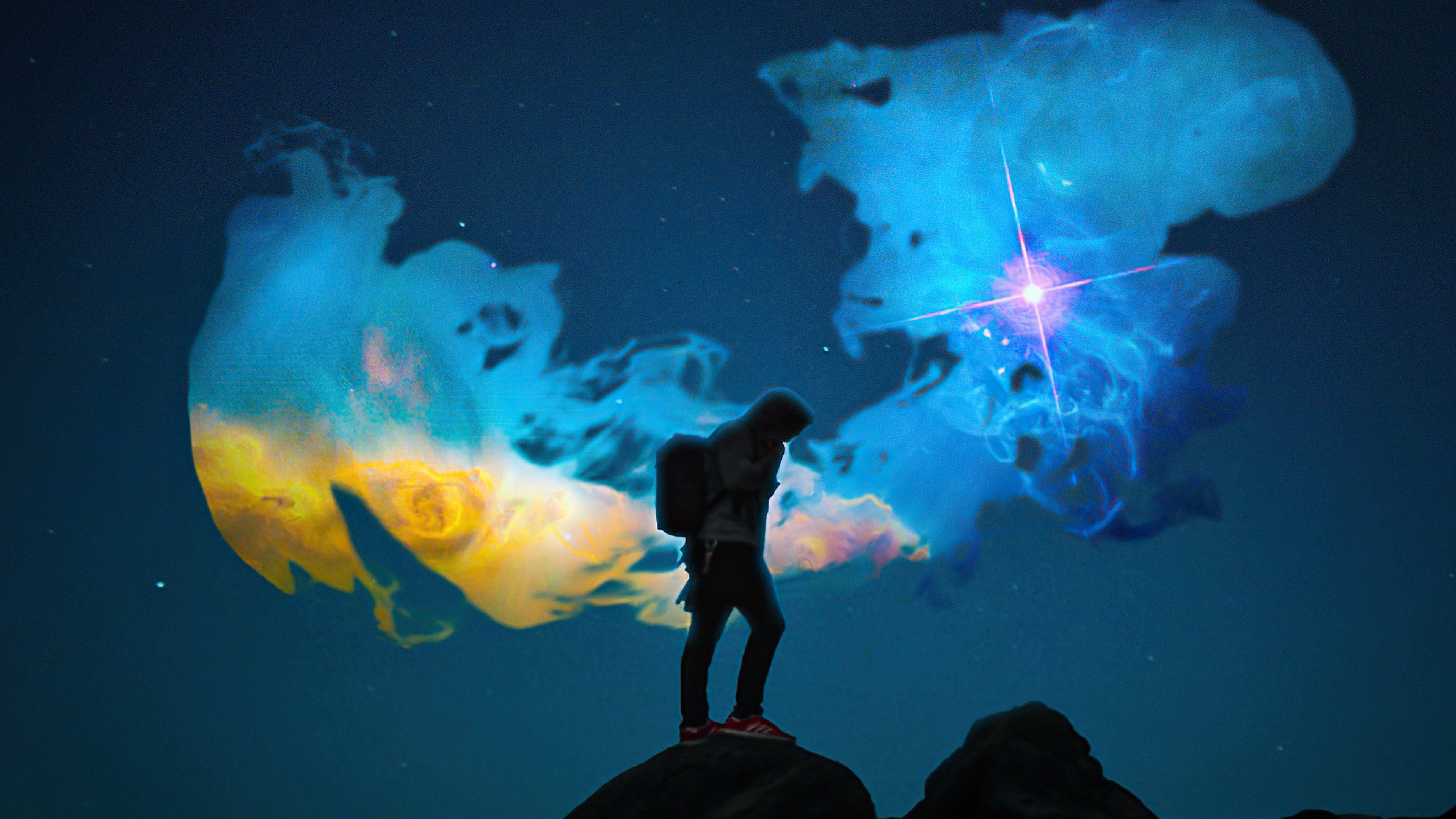 Person standing on rocks with nebula projection HD Wallpaper