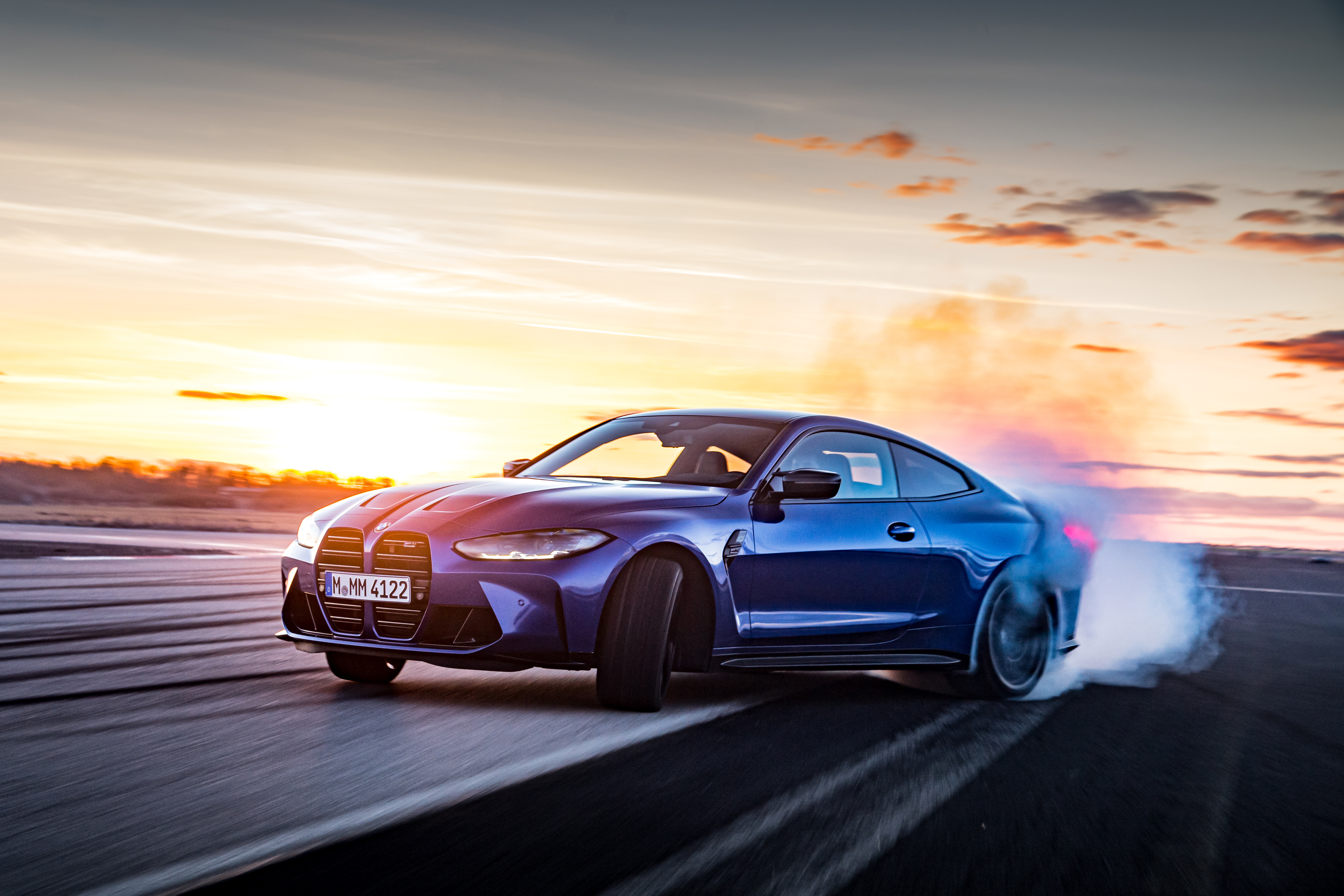 Blue BMW M4 Drifting at Sunset HD Wallpaper