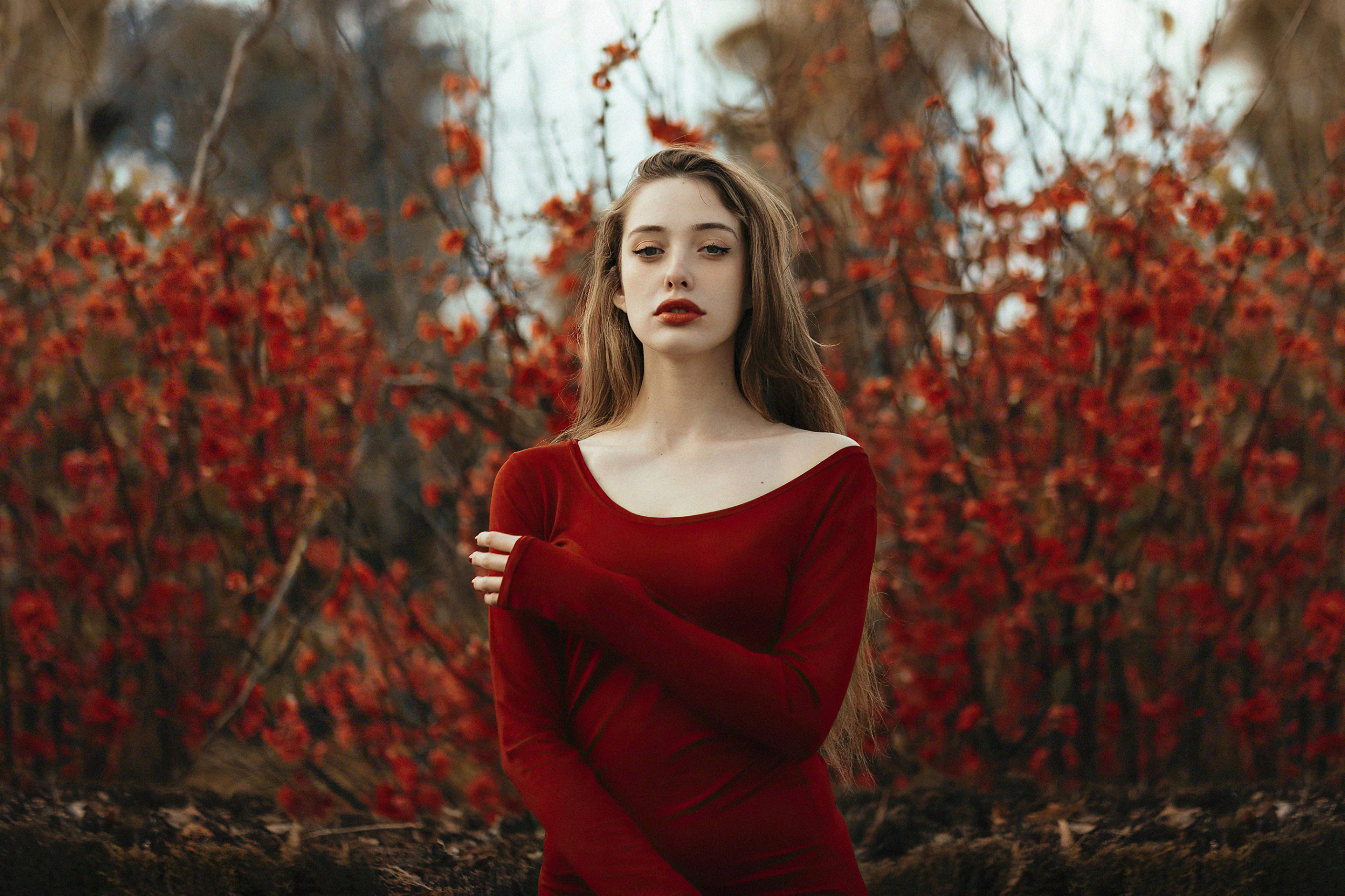 Model in a red dress with red flowers HD Wallpaper