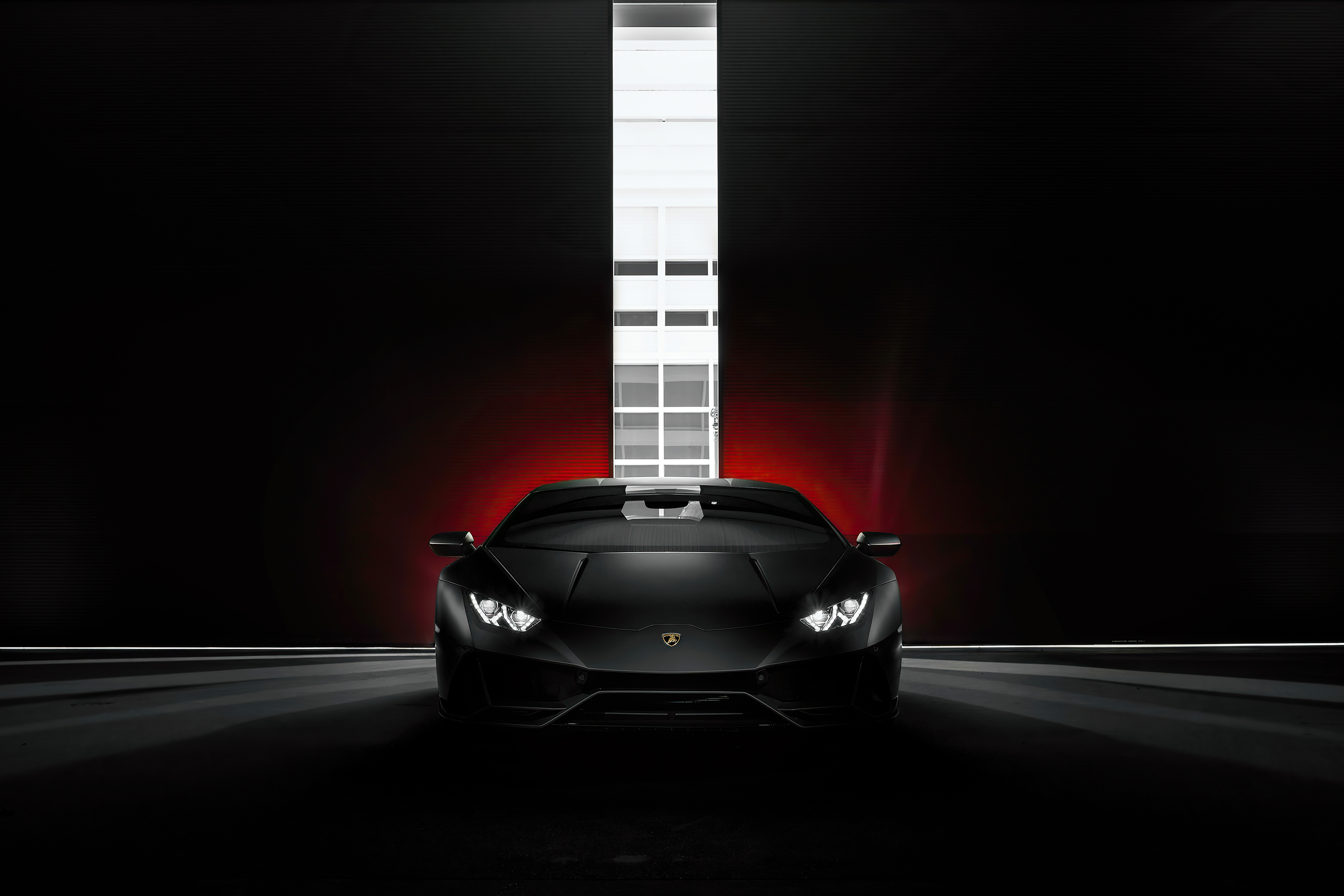 Black Lamborghini Huracan in a dark setting HD Wallpaper