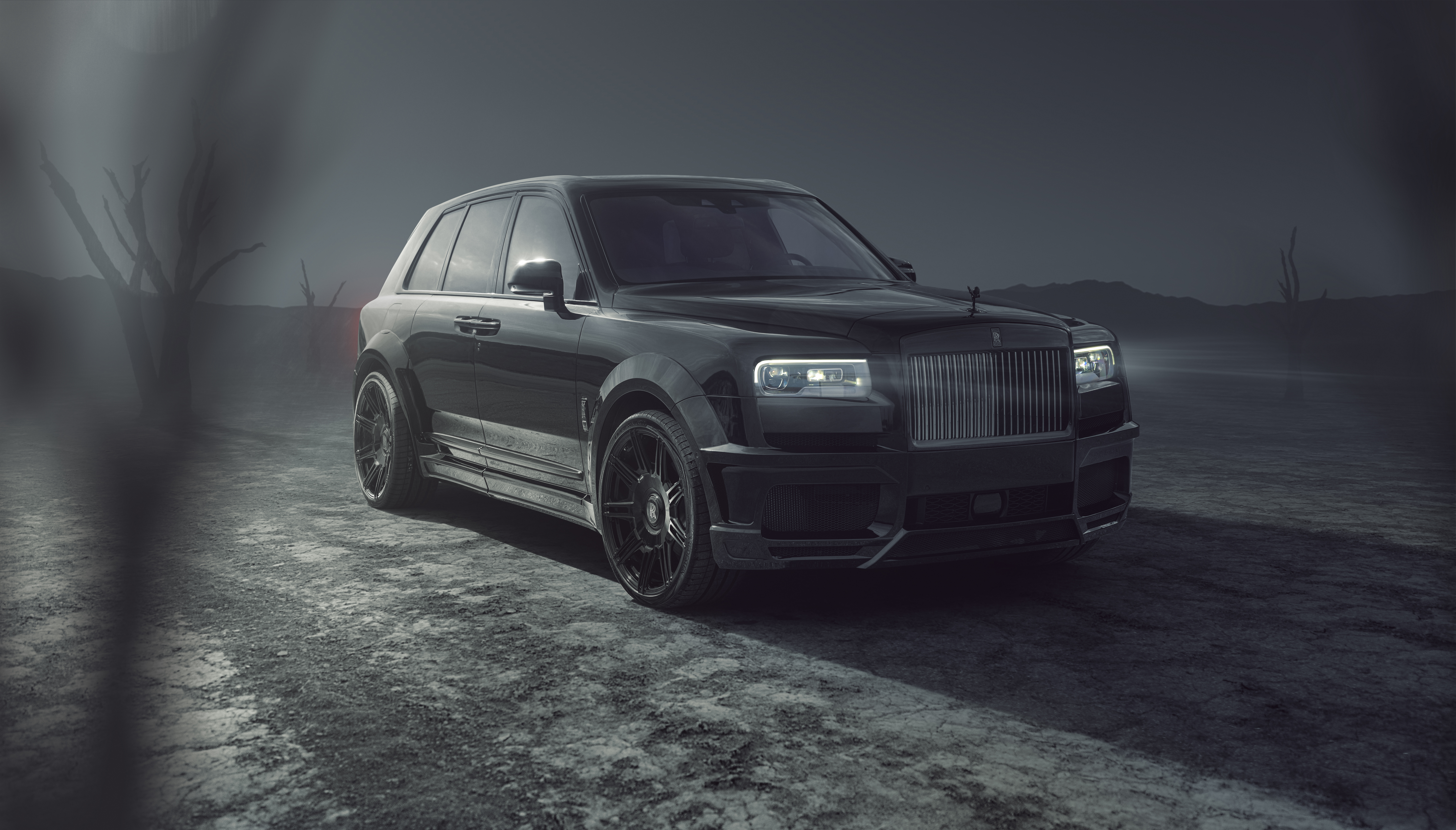 Black Rolls Royce Cullinan in a desolate landscape HD Wallpaper