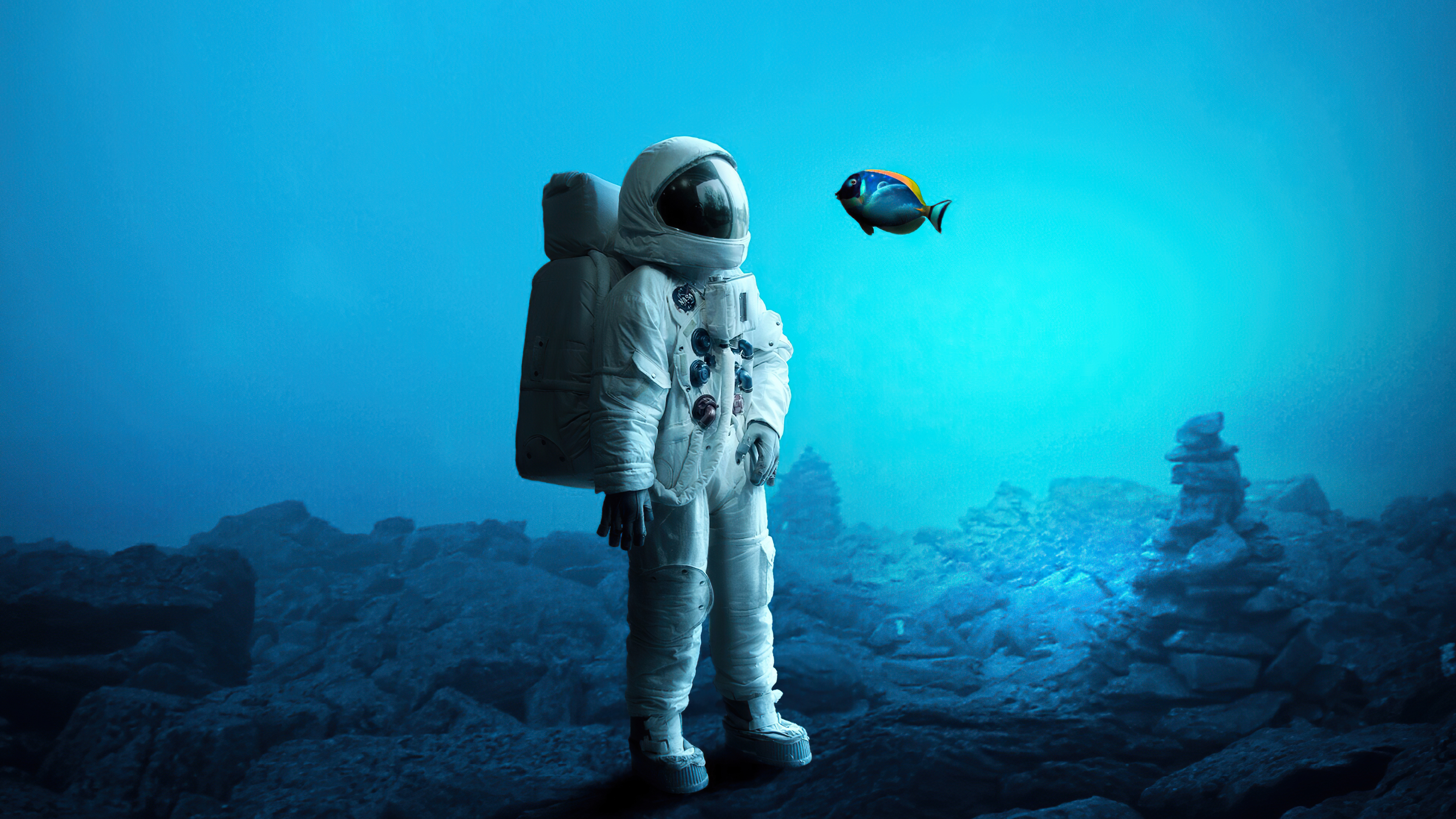 Astronaut in underwater scene with fish HD Wallpaper