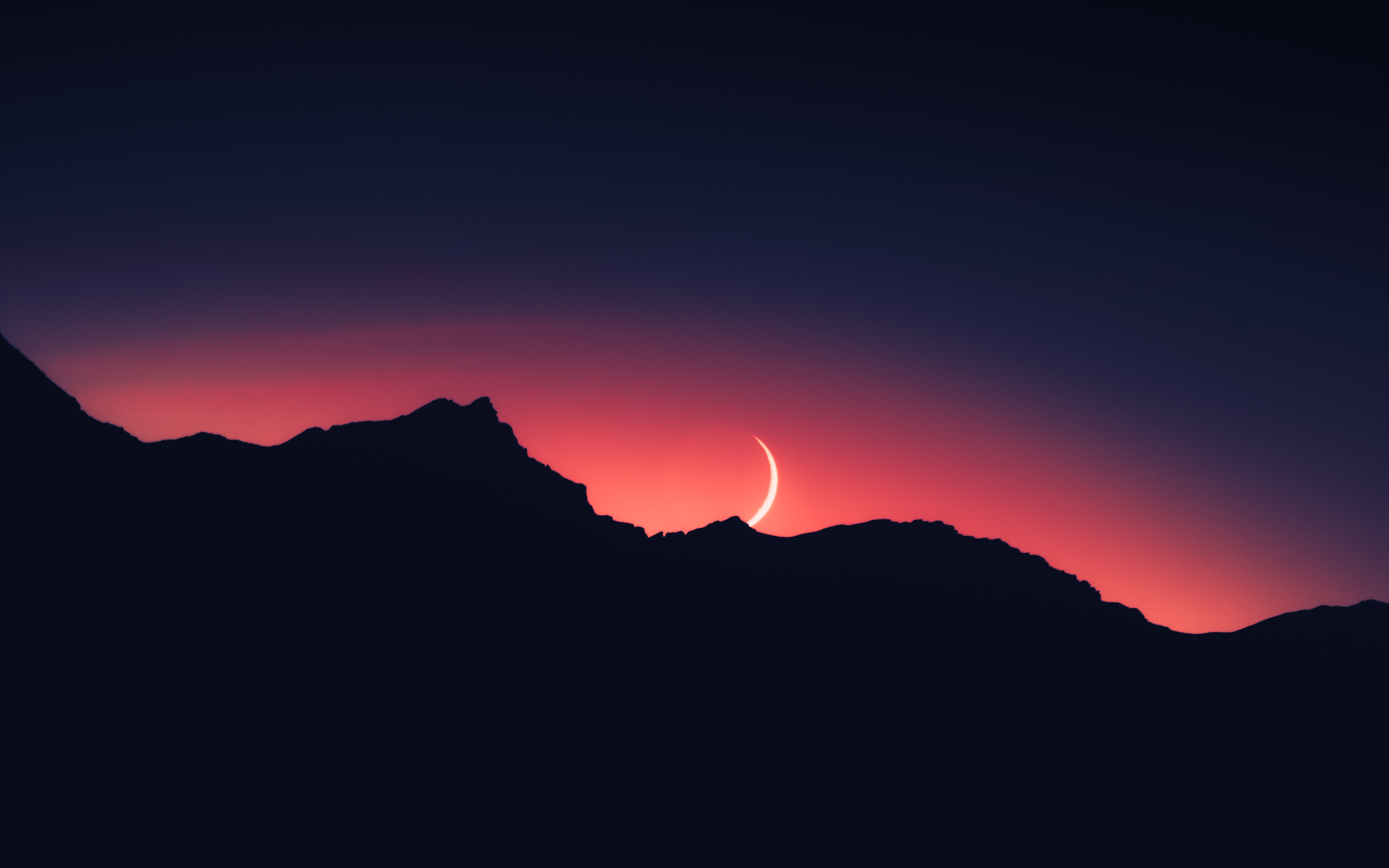 Crescent moon over silhouetted mountains at sunset HD Wallpaper