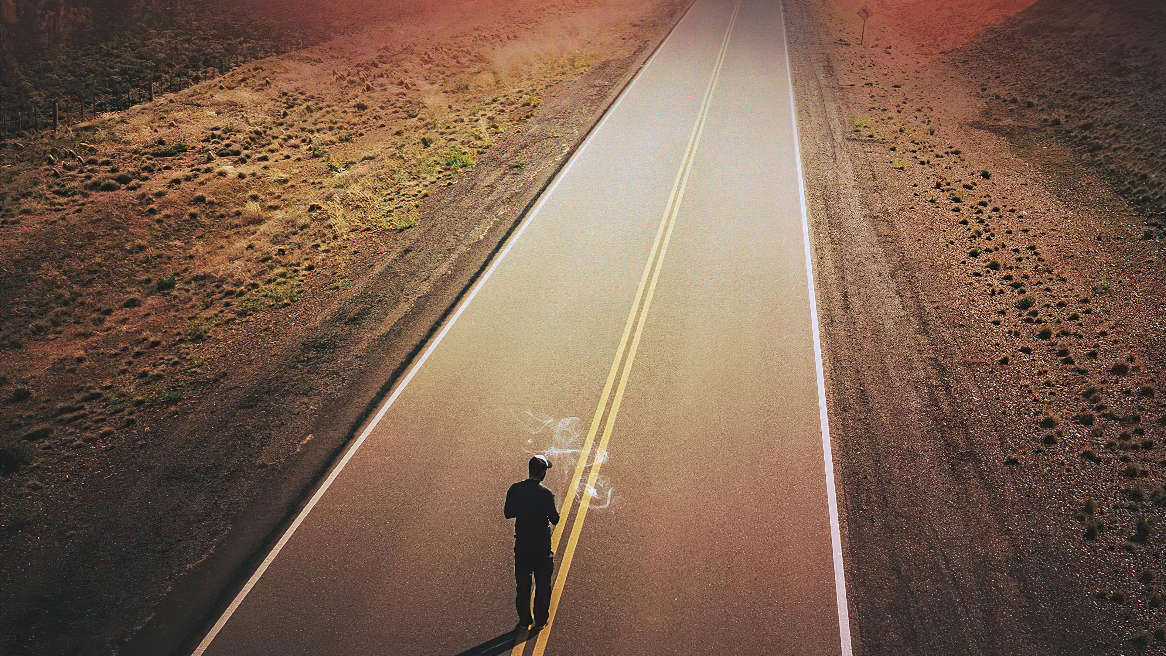 Man walking on a lonely road HD Wallpaper