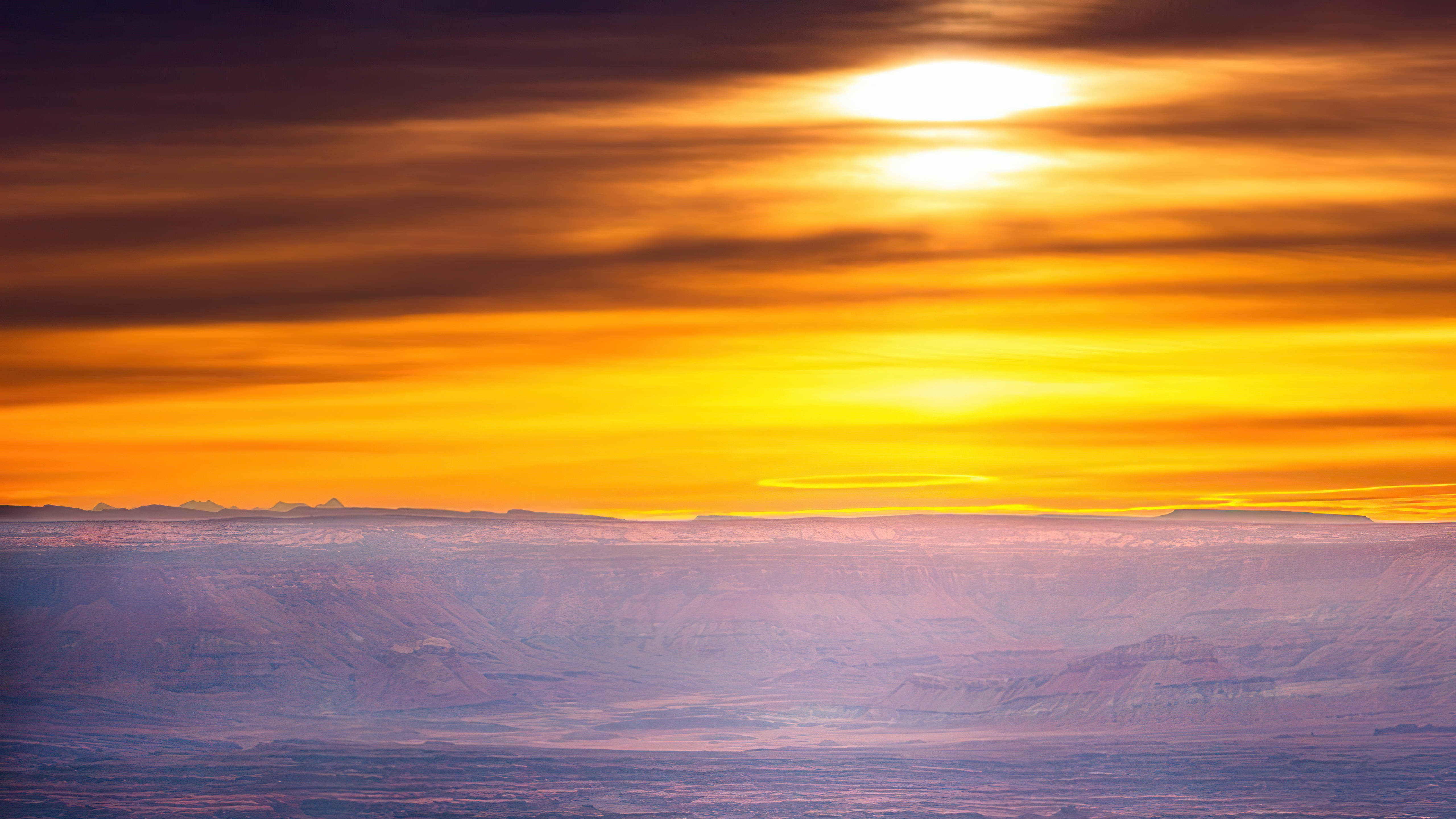 Sunset over a vast canyon landscape HD Wallpaper