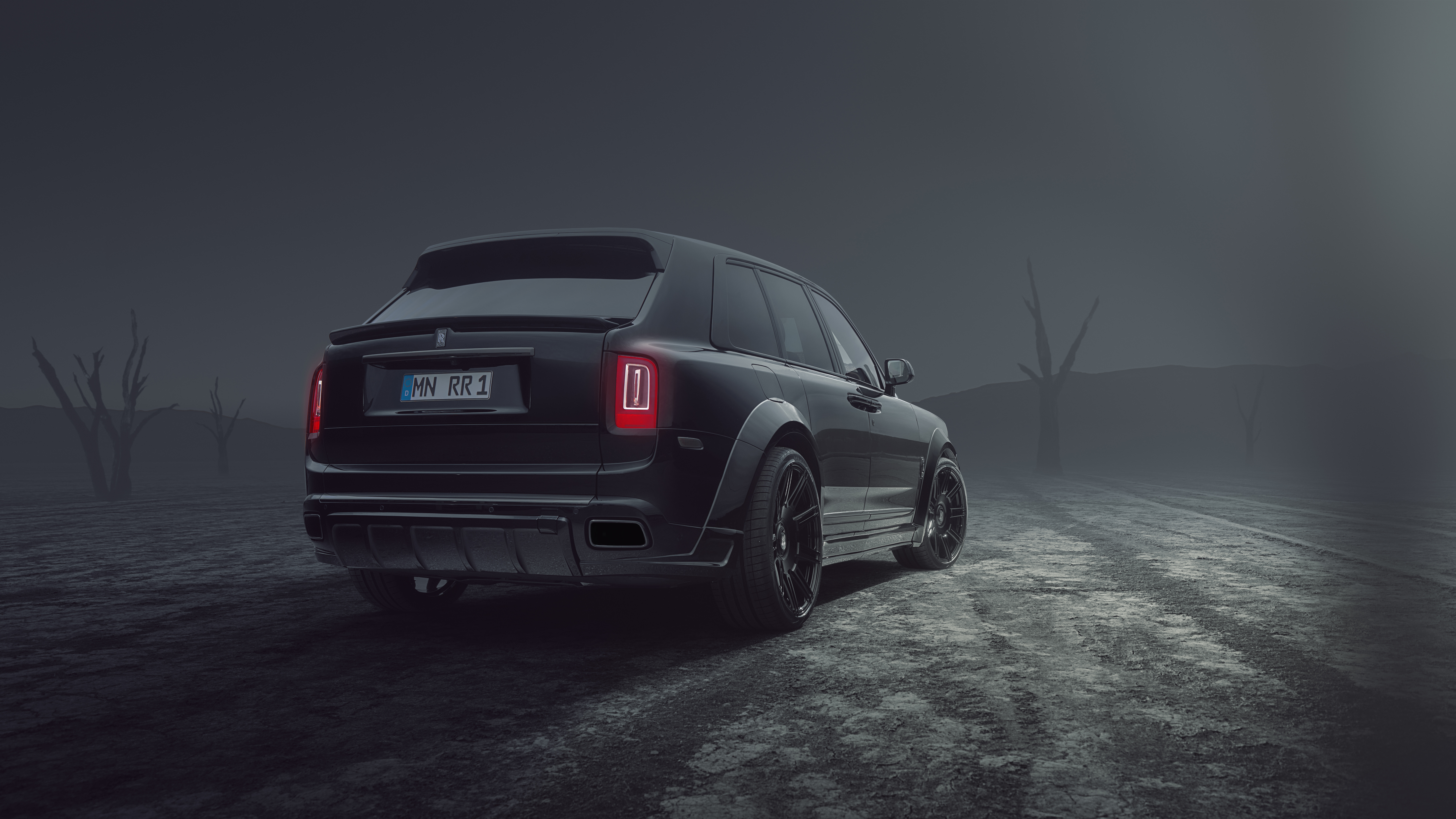 Black Rolls Royce Cullinan in a desolate landscape HD Wallpaper