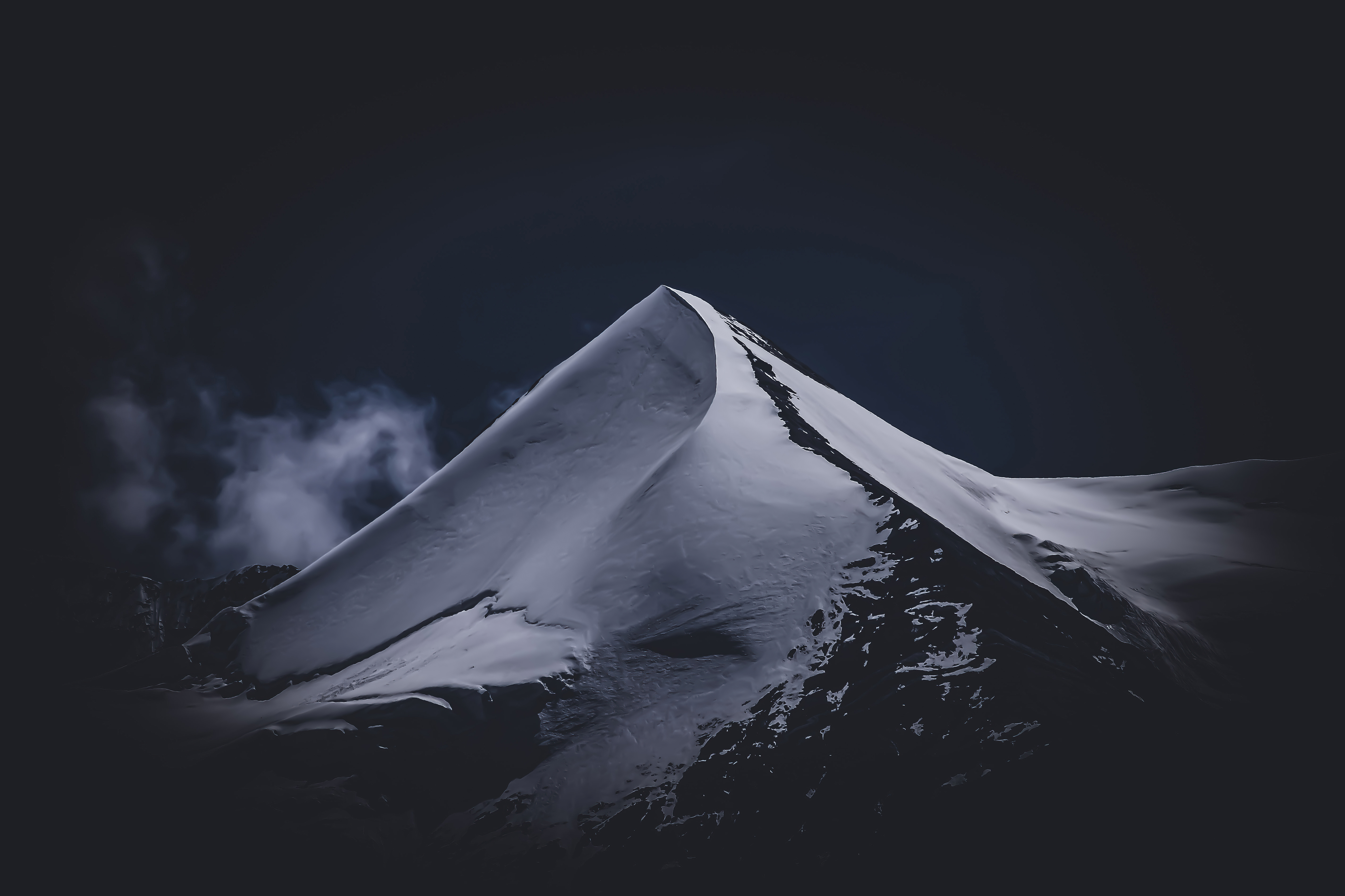 Snowy mountain peak against dark sky HD Wallpaper