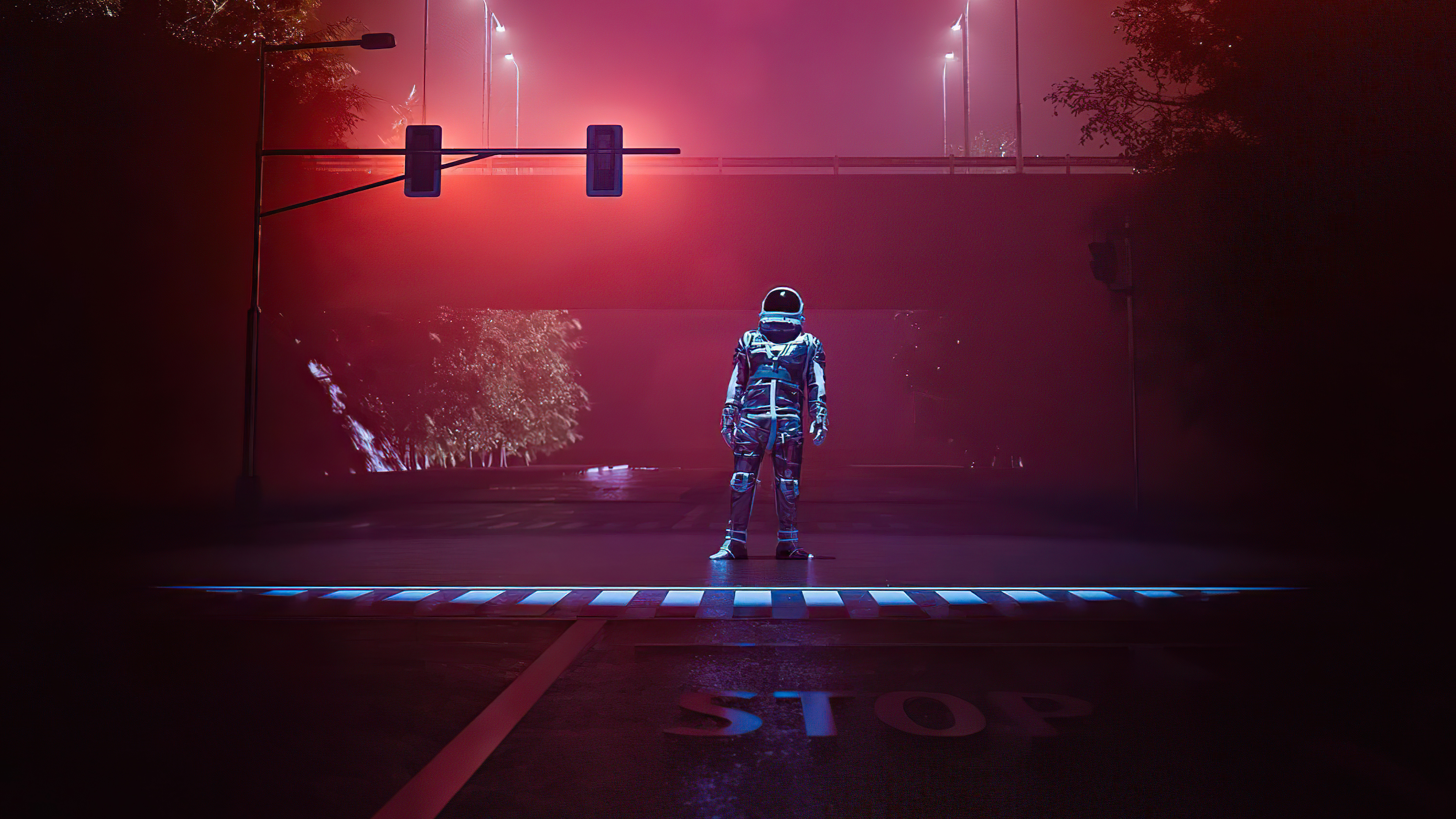 Astronaut standing at a foggy intersection at night HD Wallpaper