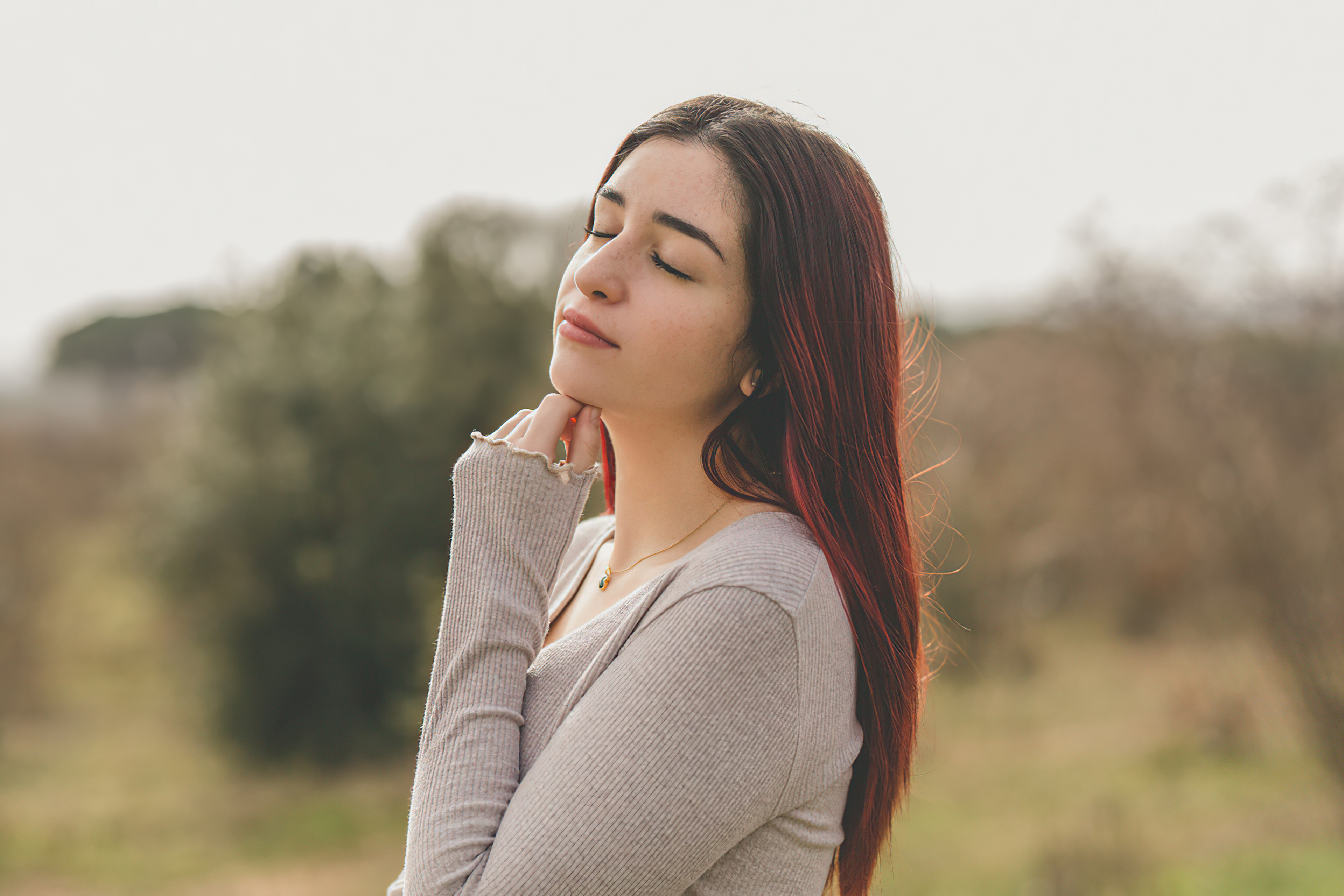 Redhead girl with eyes closed outdoors HD Wallpaper