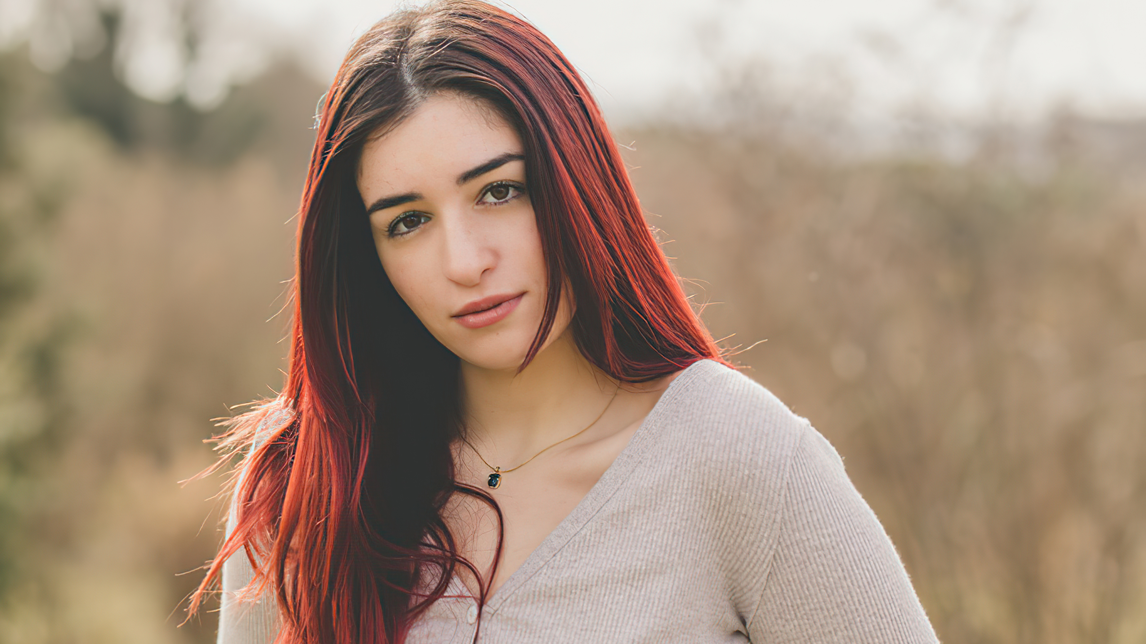 Young woman with red hair outdoors HD Wallpaper