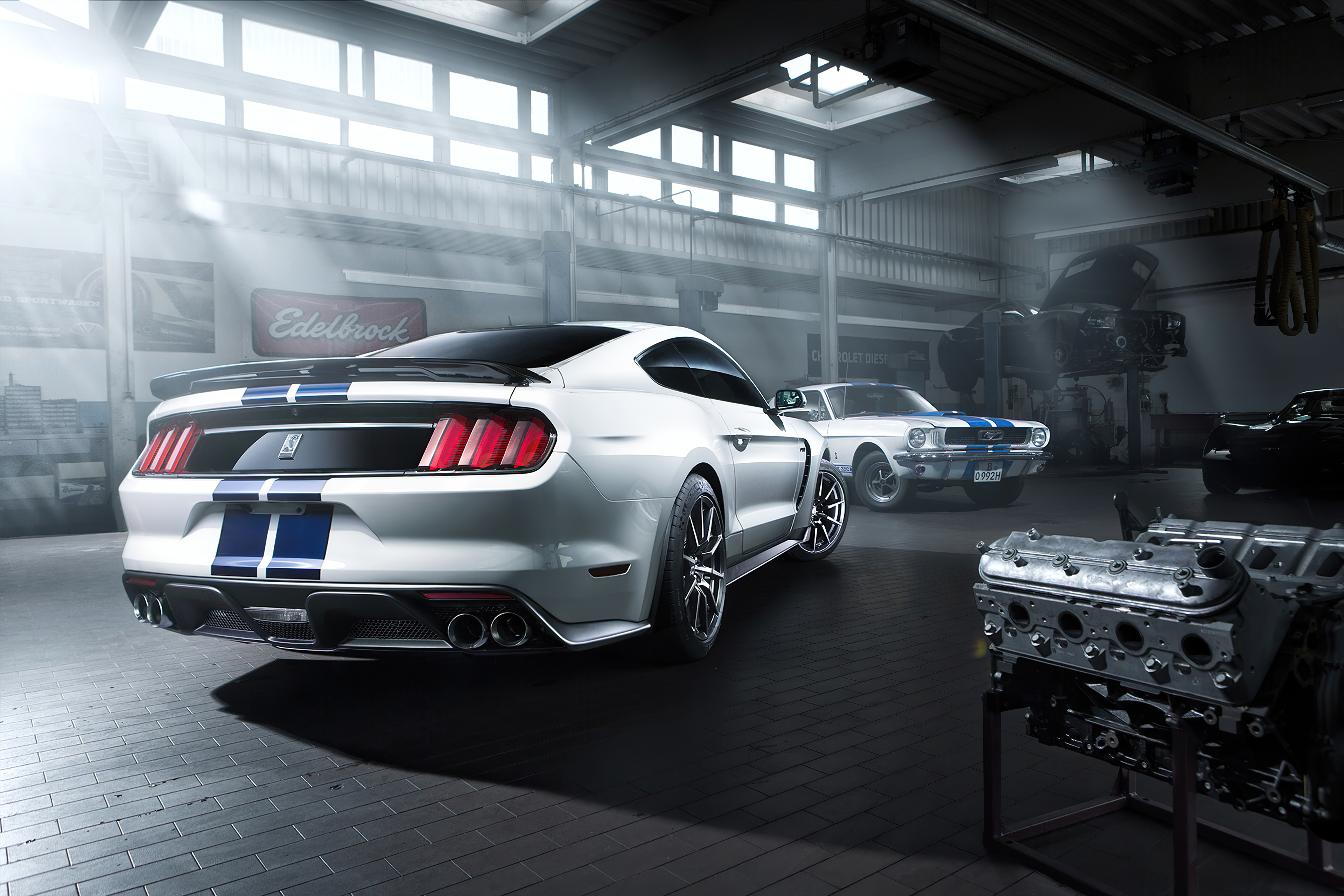 Ford Mustang cars in a garage with engine HD Wallpaper