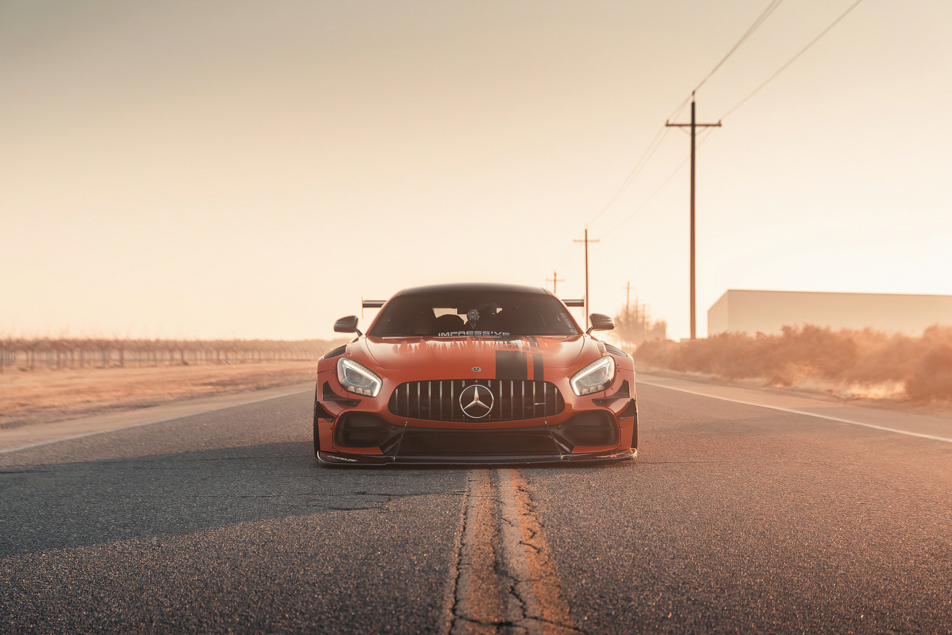 Orange Mercedes-AMG GT R on a road HD Wallpaper