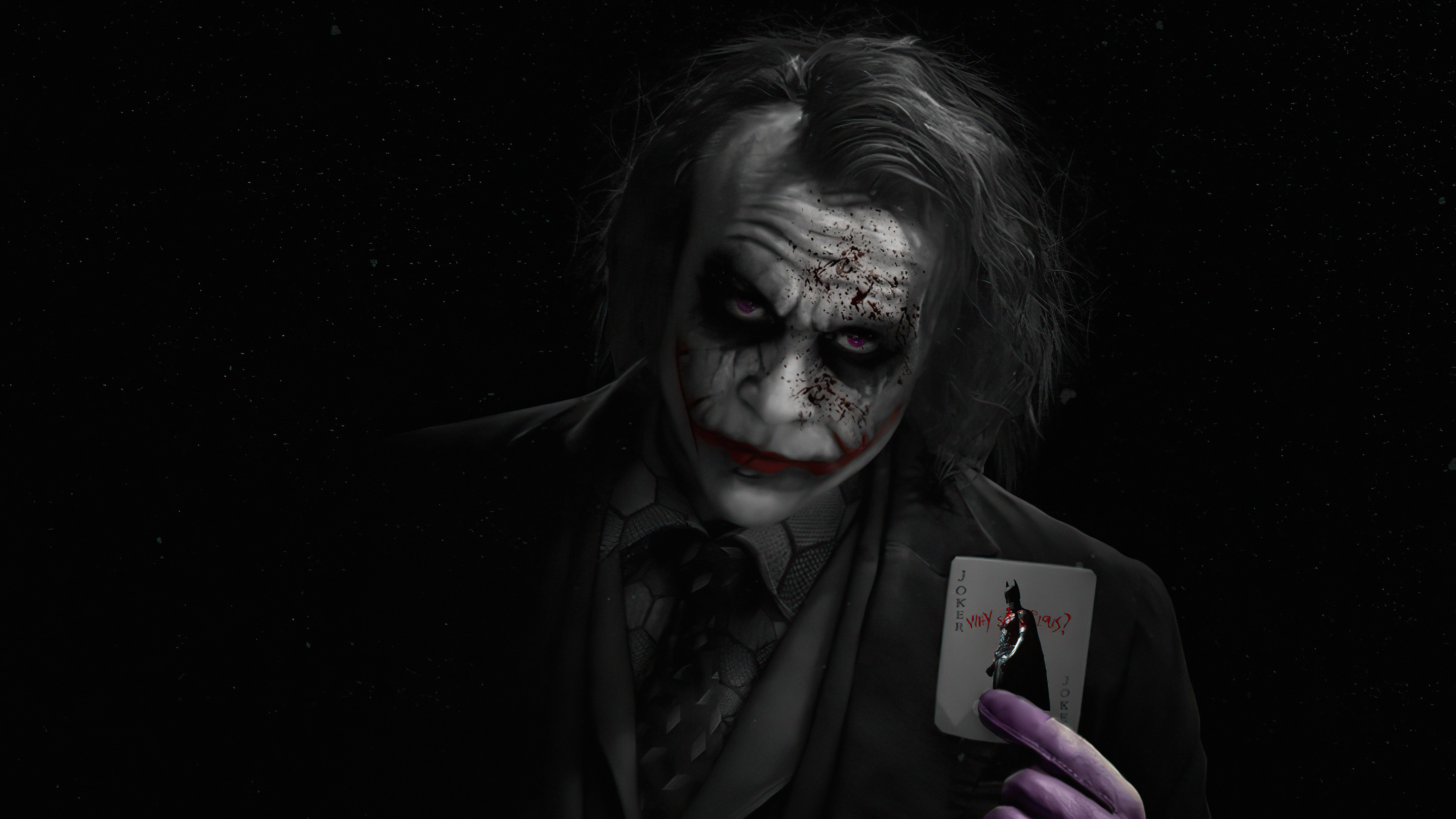 Joker from Batman holding a playing card HD Wallpaper