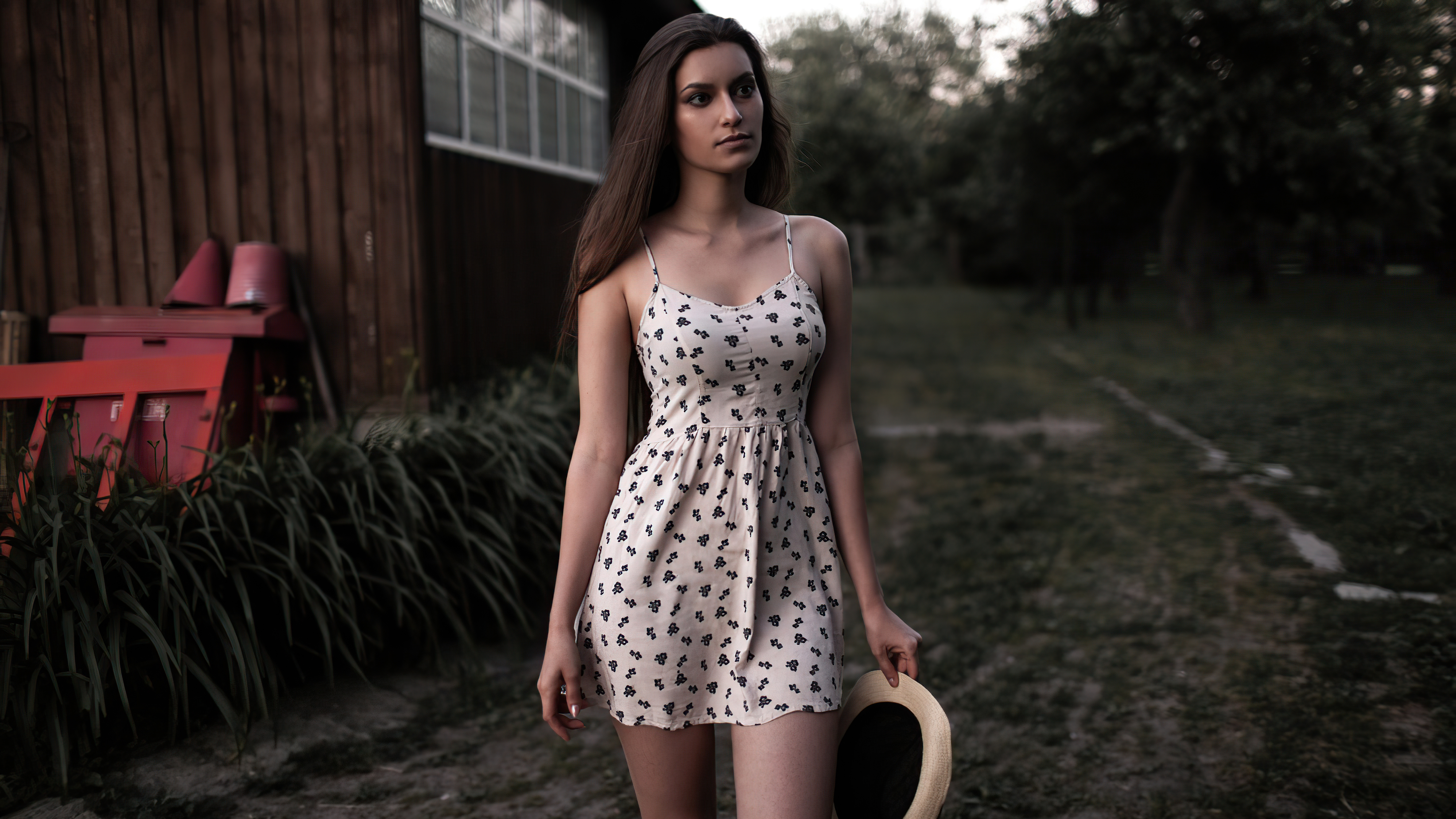 Girl in a floral dress holding a hat HD Wallpaper