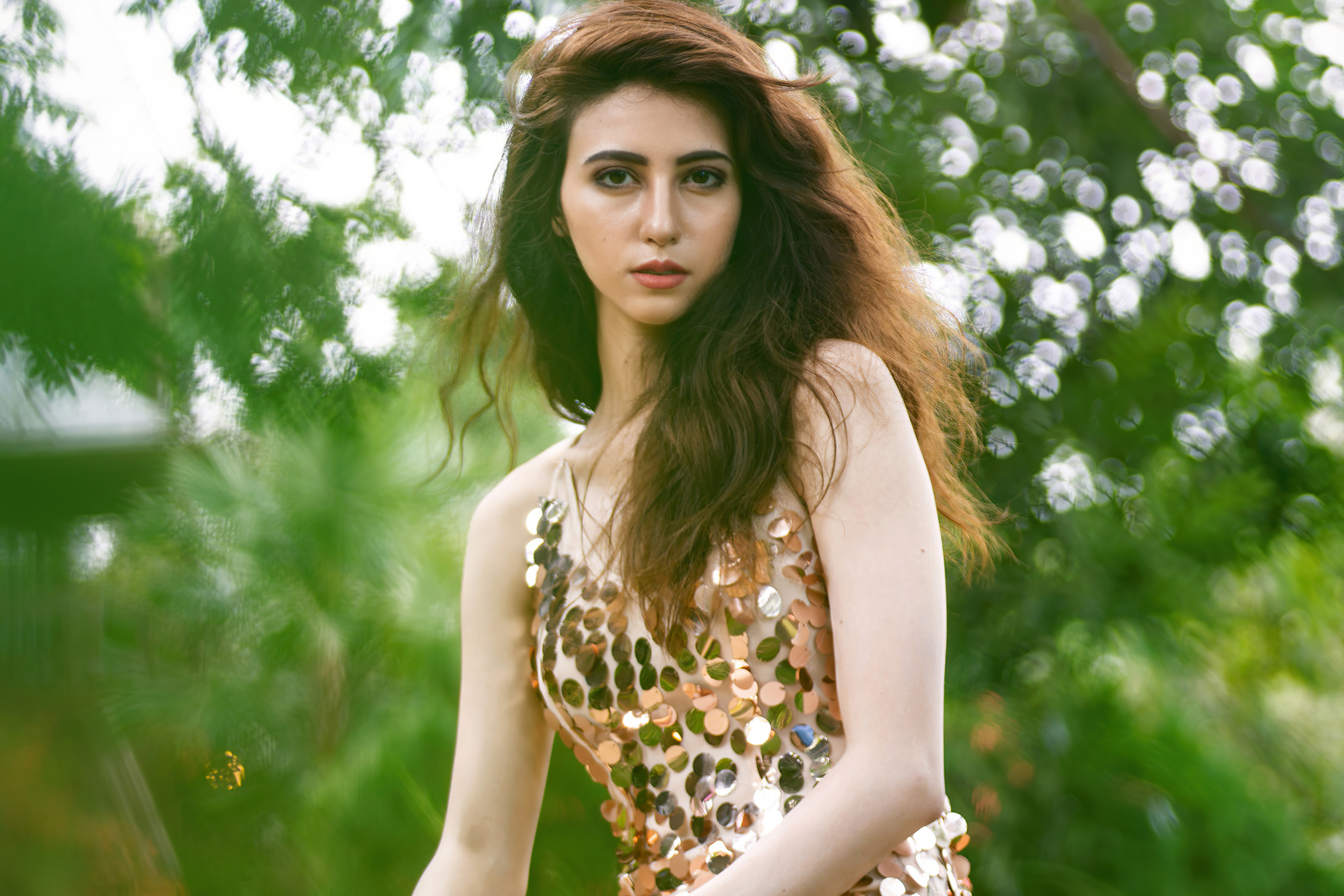 Model in sequined dress with bokeh background HD Wallpaper
