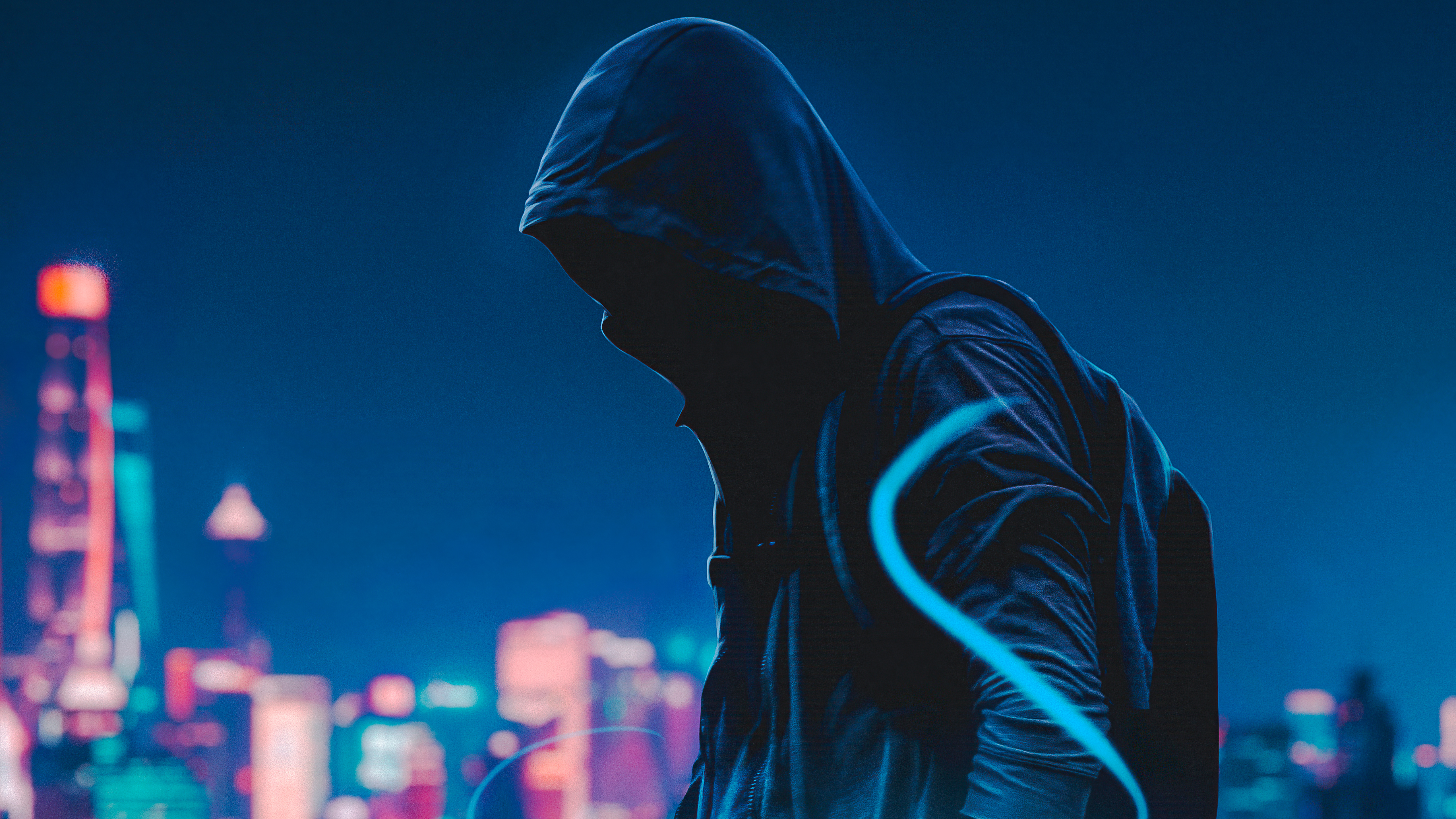 Person in hoodie against city skyline HD Wallpaper