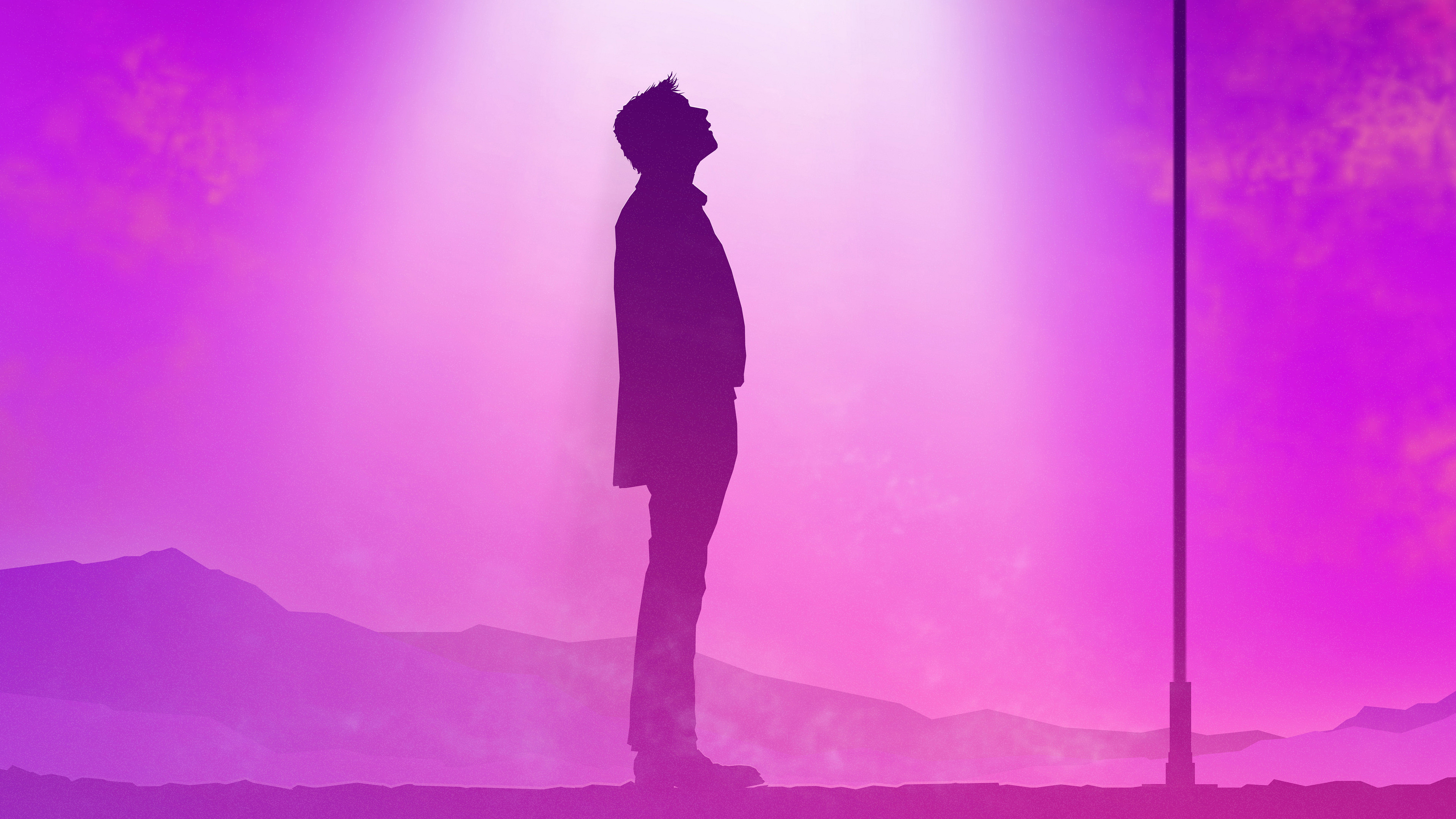 Silhouette of a man looking up at a light HD Wallpaper