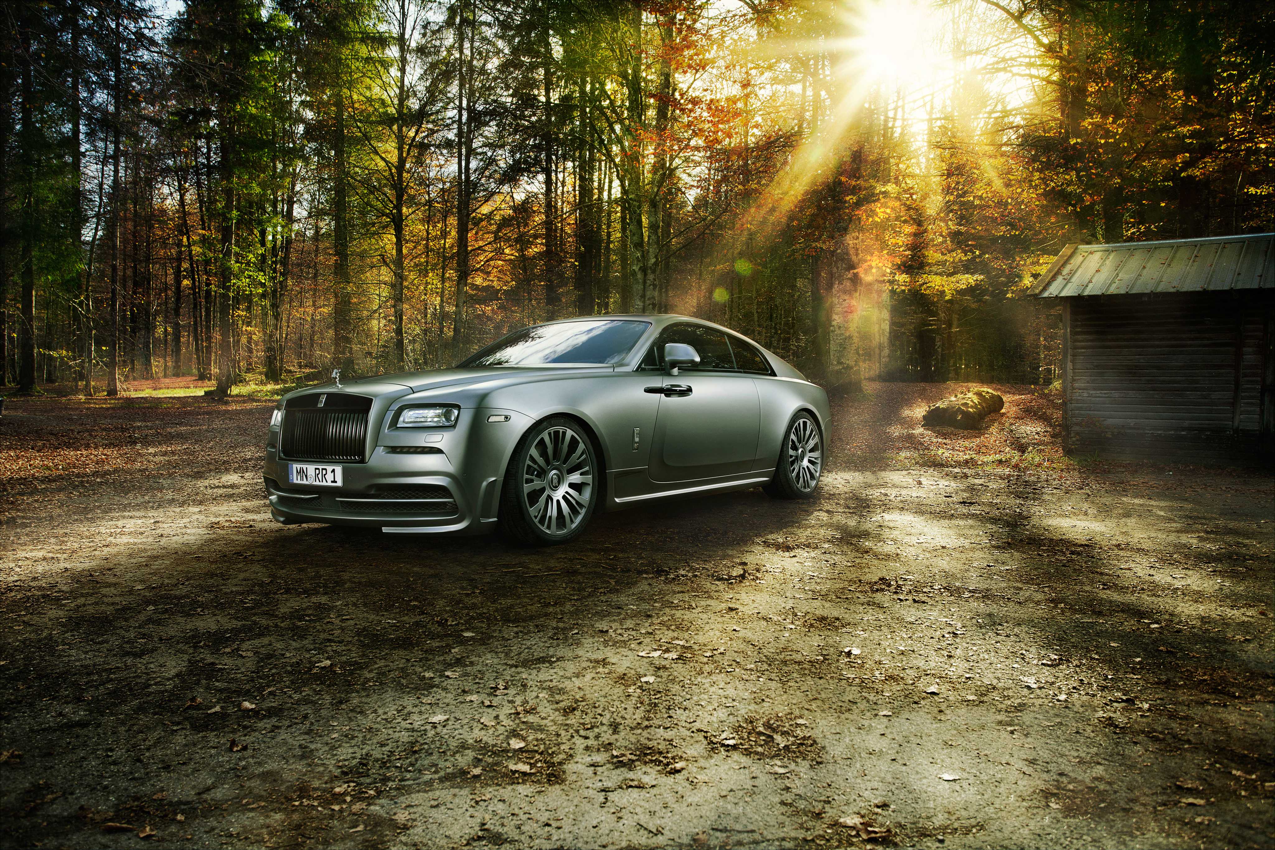 Rolls-Royce Wraith in a forest setting HD Wallpaper