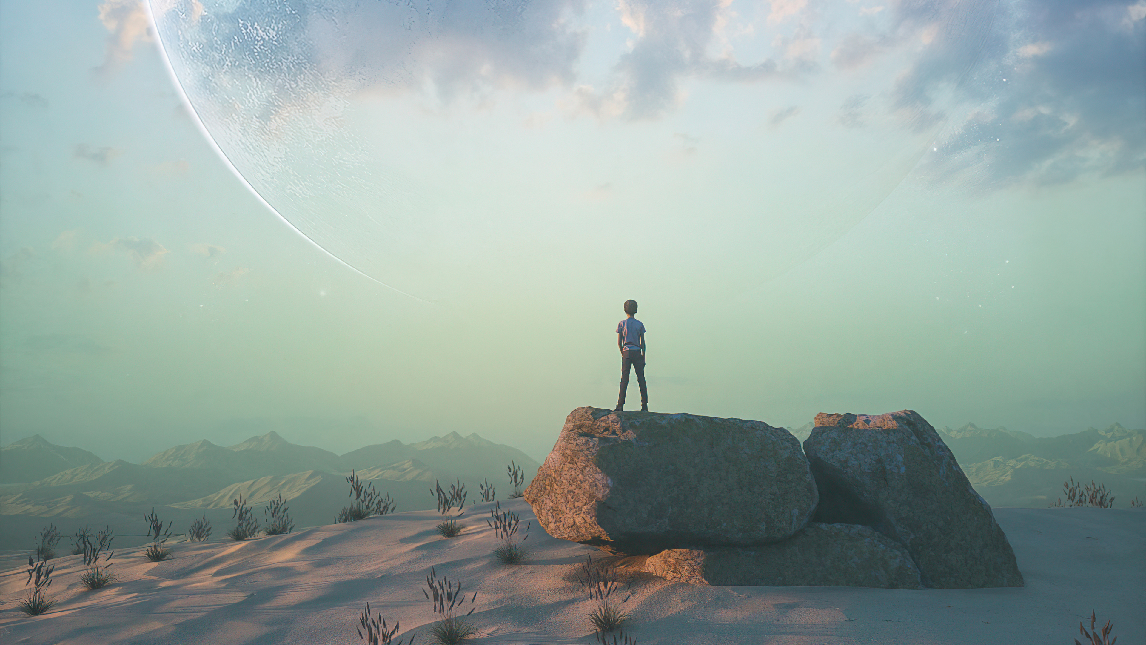 A lone figure stands on rocks in a desert landscape with a large planet in the sky HD Wallpaper