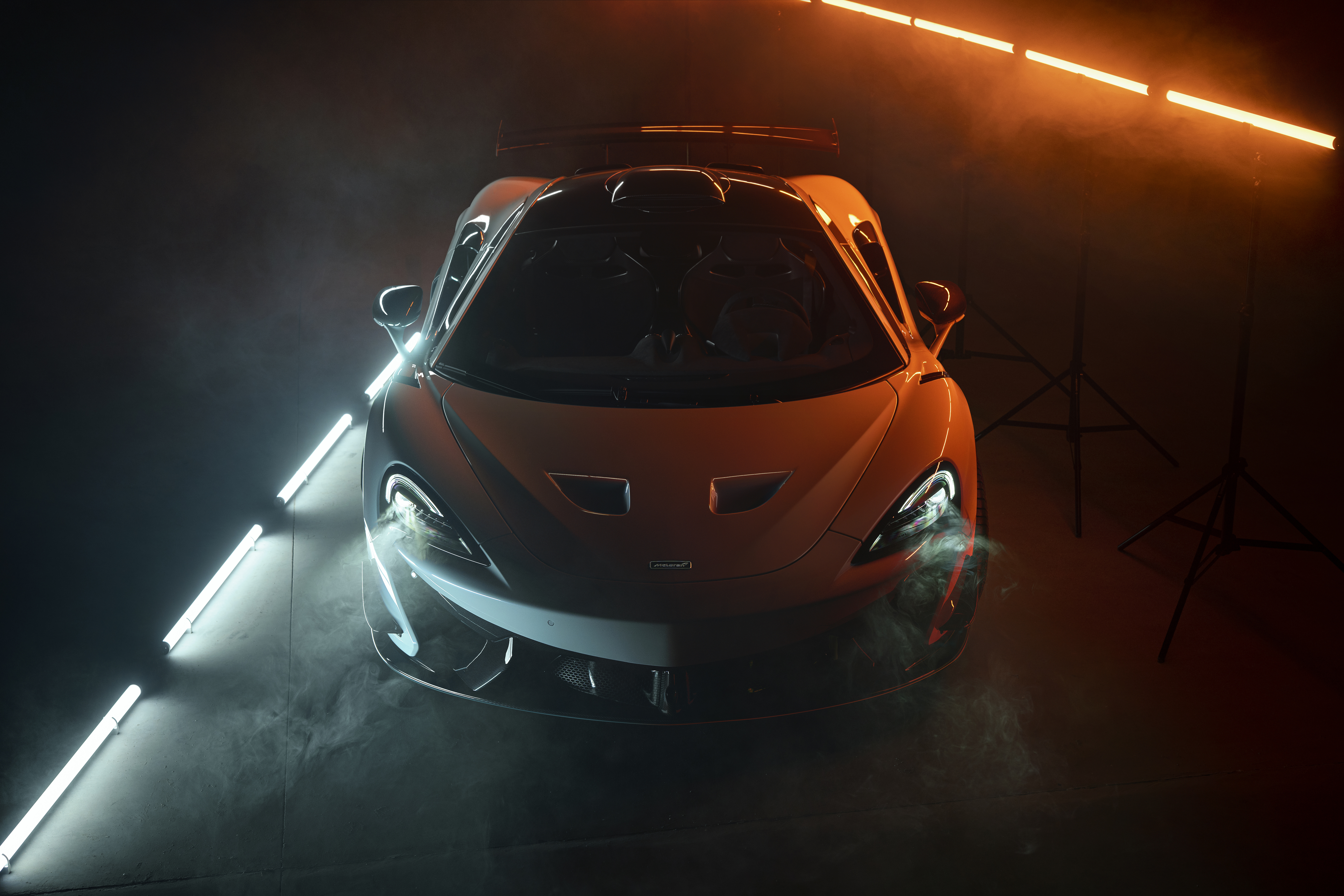 McLaren 620R sports car with orange and blue lighting HD Wallpaper