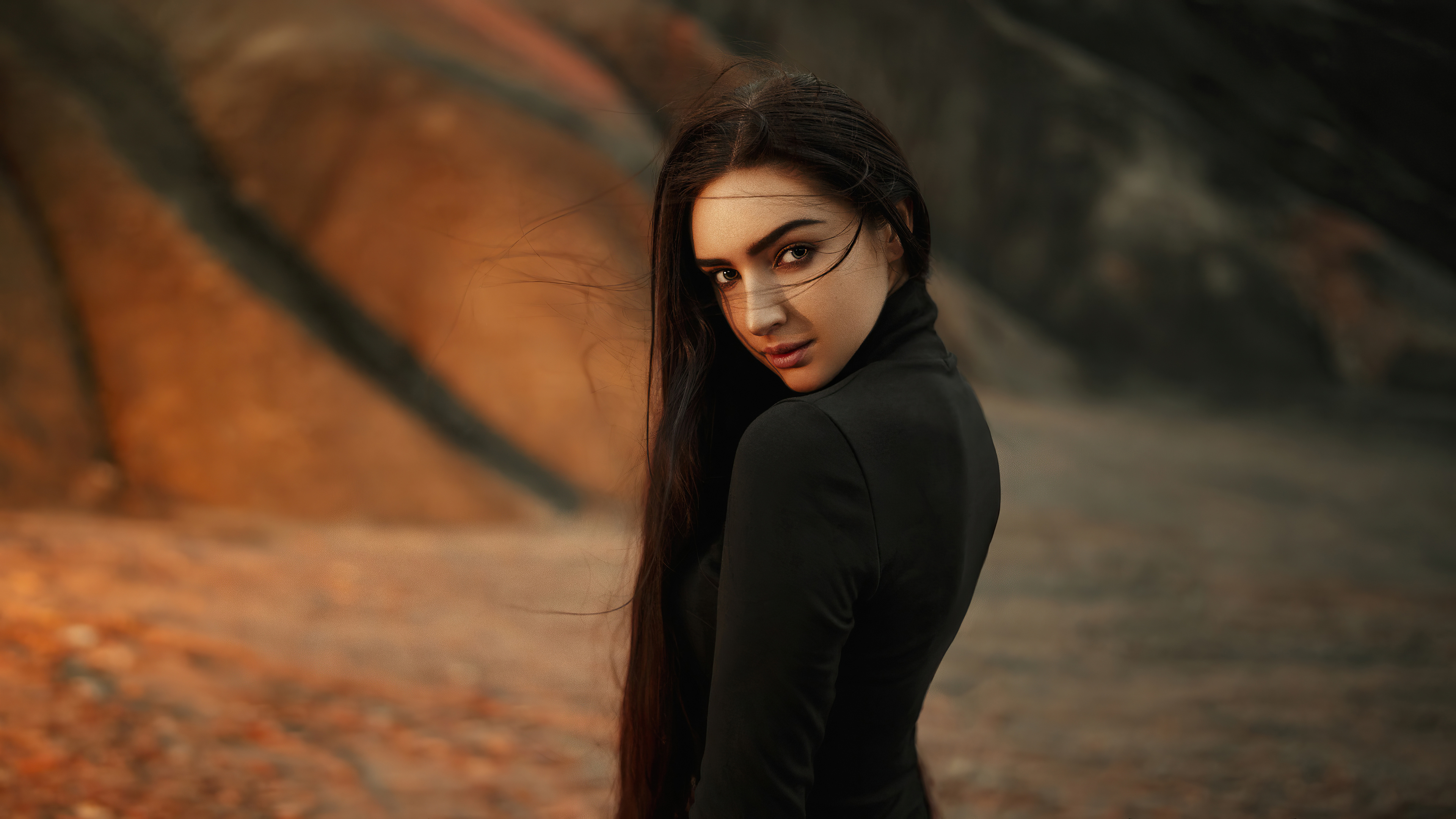Woman in black dress in a rocky landscape HD Wallpaper