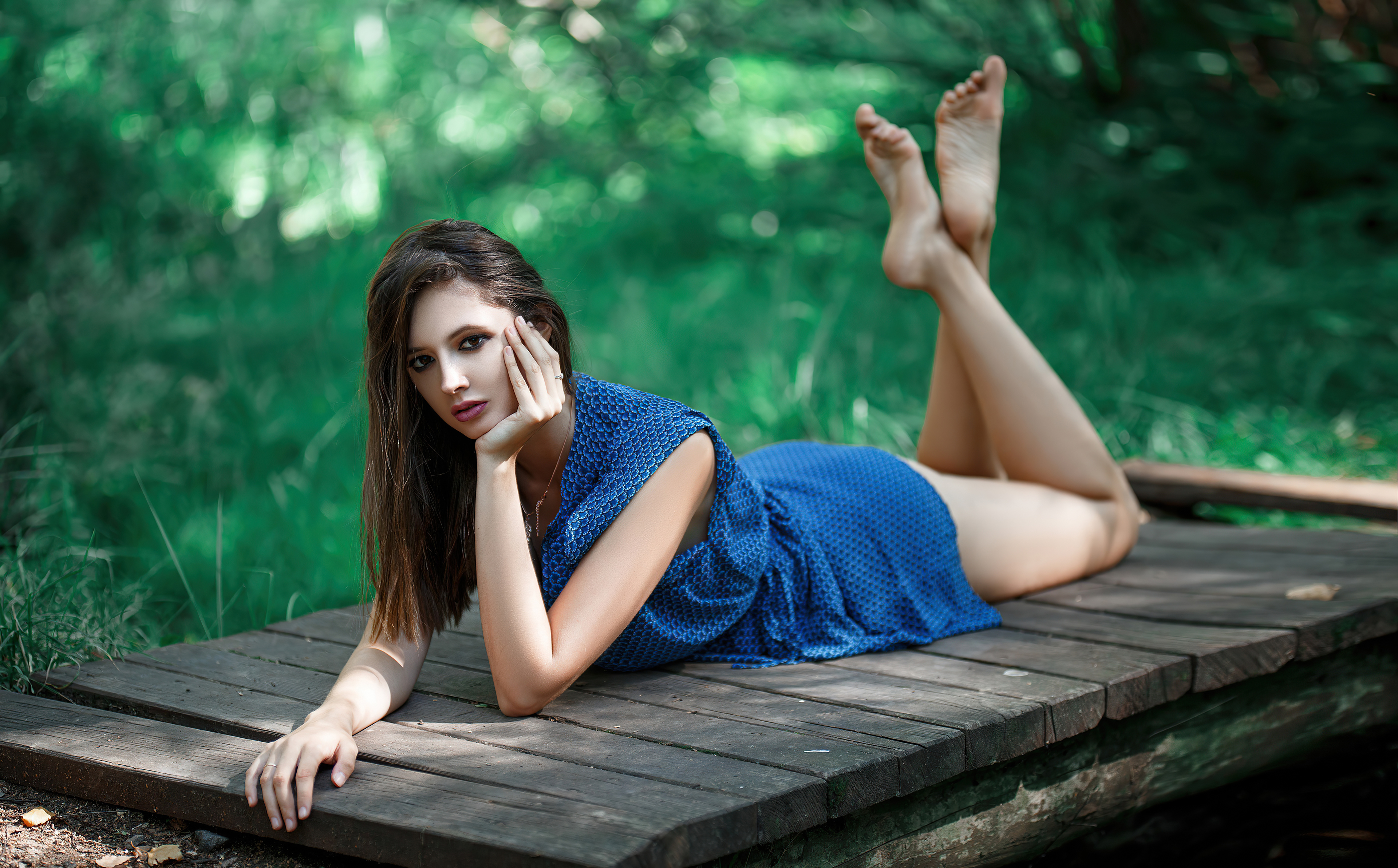 Model in blue dress on wooden bridge HD Wallpaper