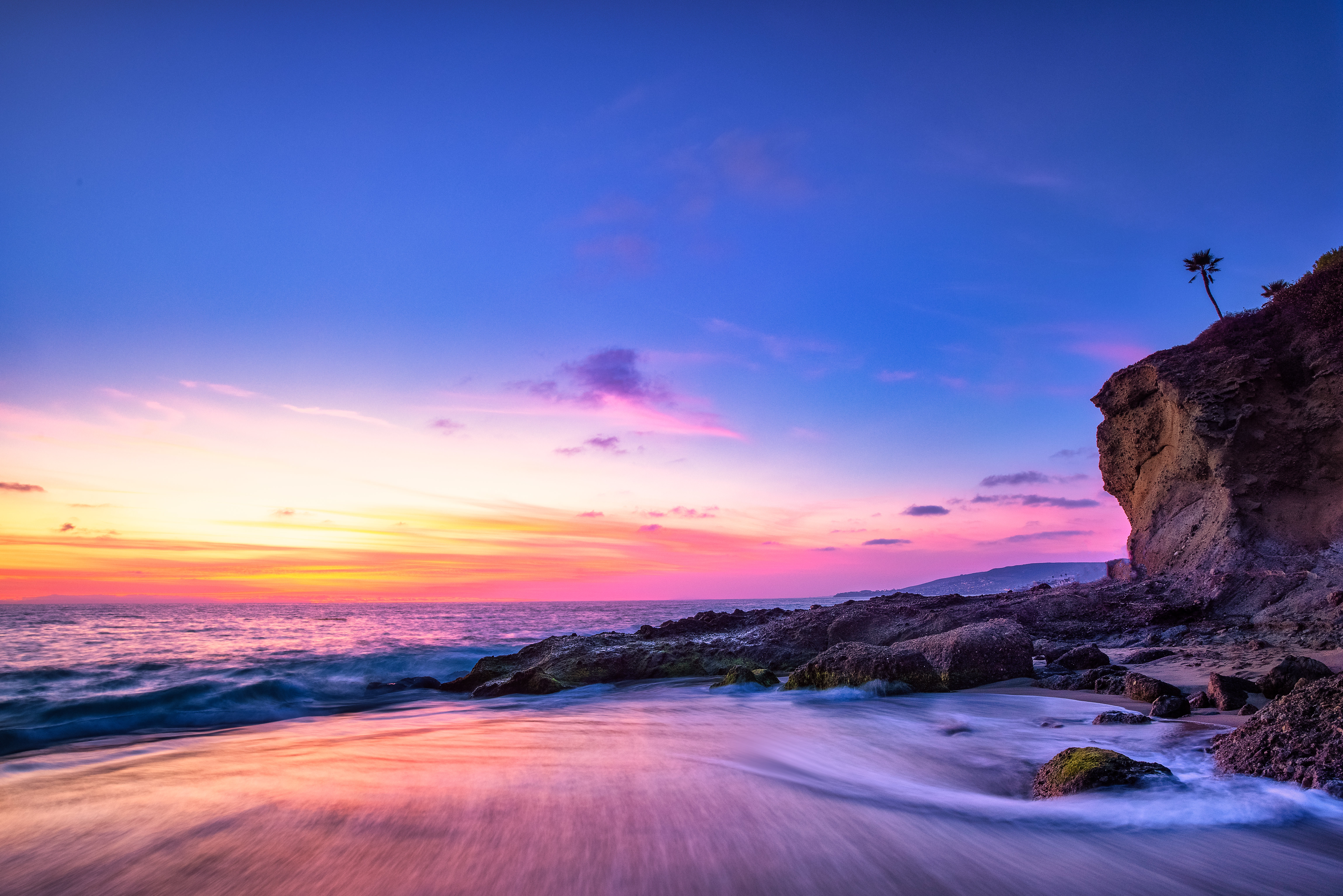 Beach seascape with long exposure at sunset HD Wallpaper