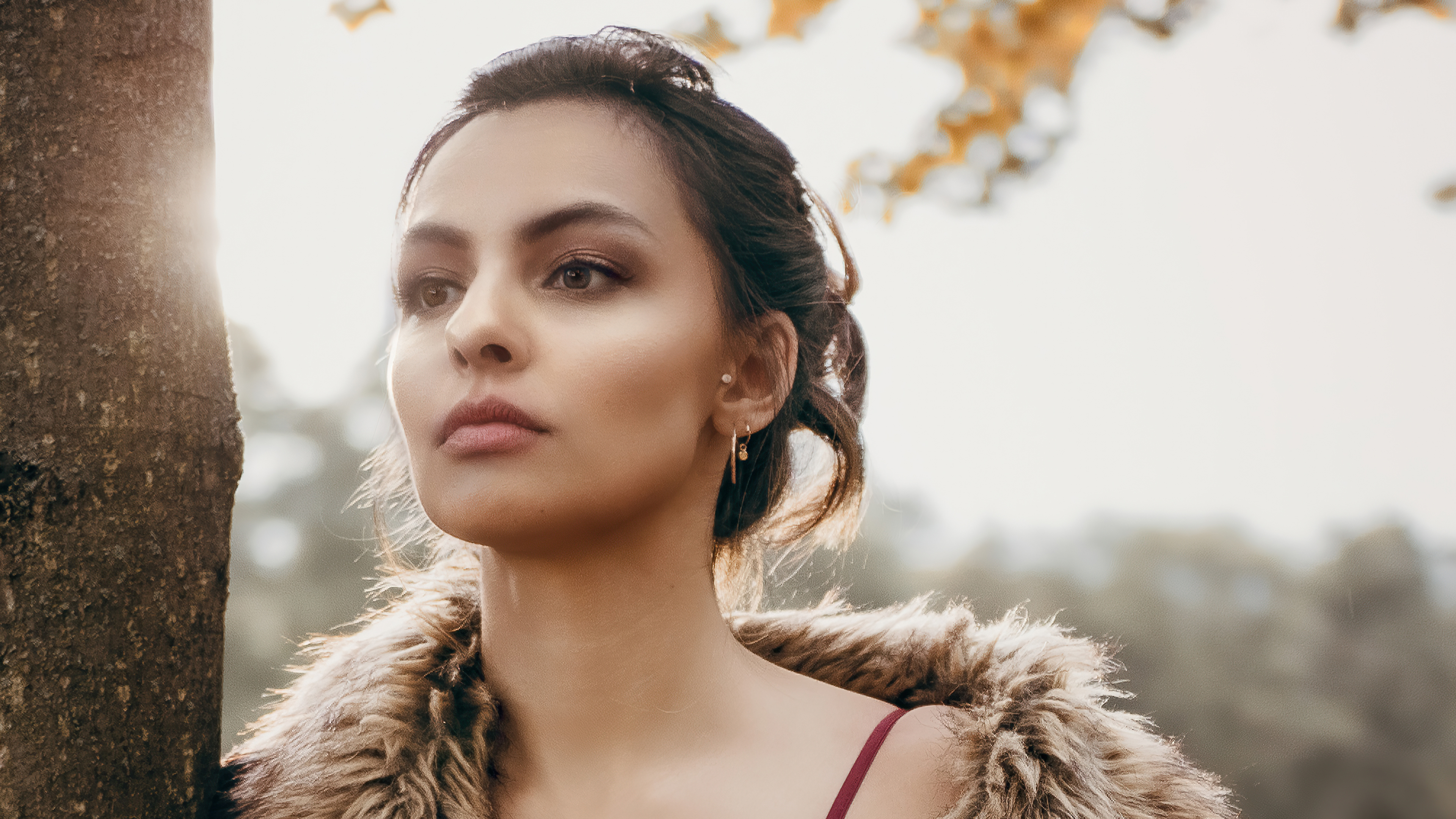 Model in fur coat near tree HD Wallpaper