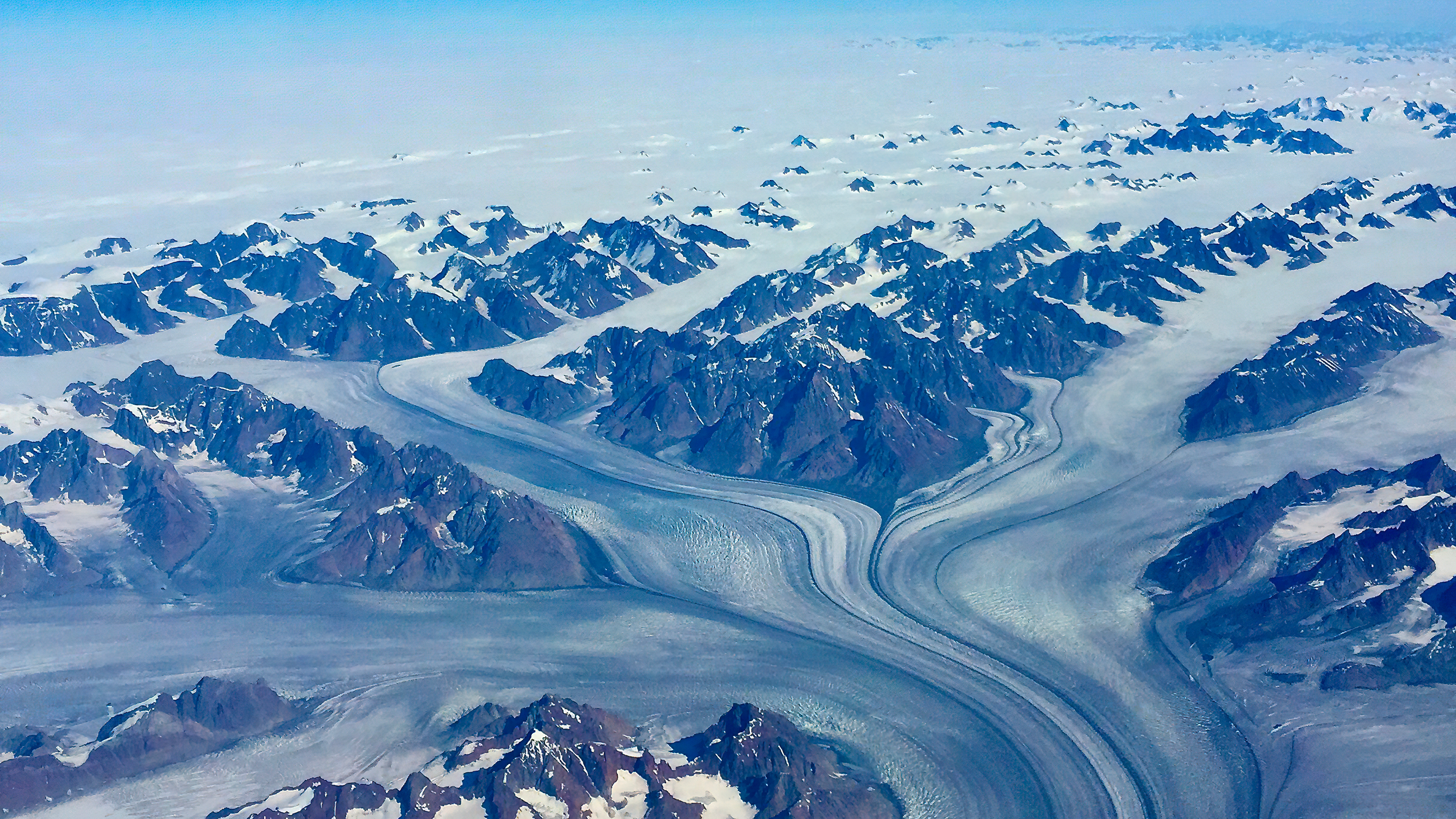 Aerial view of glaciers and snow-capped mountains HD Wallpaper