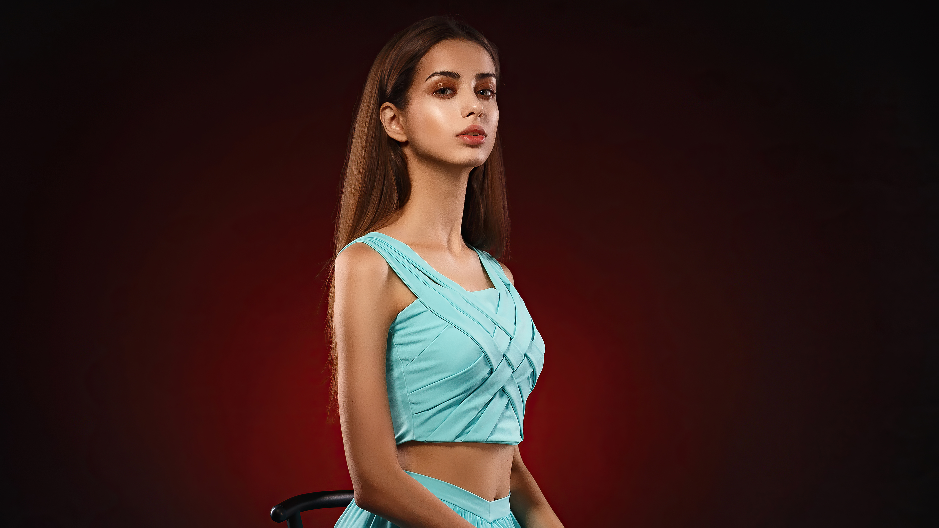Model in a blue dress on a red background HD Wallpaper