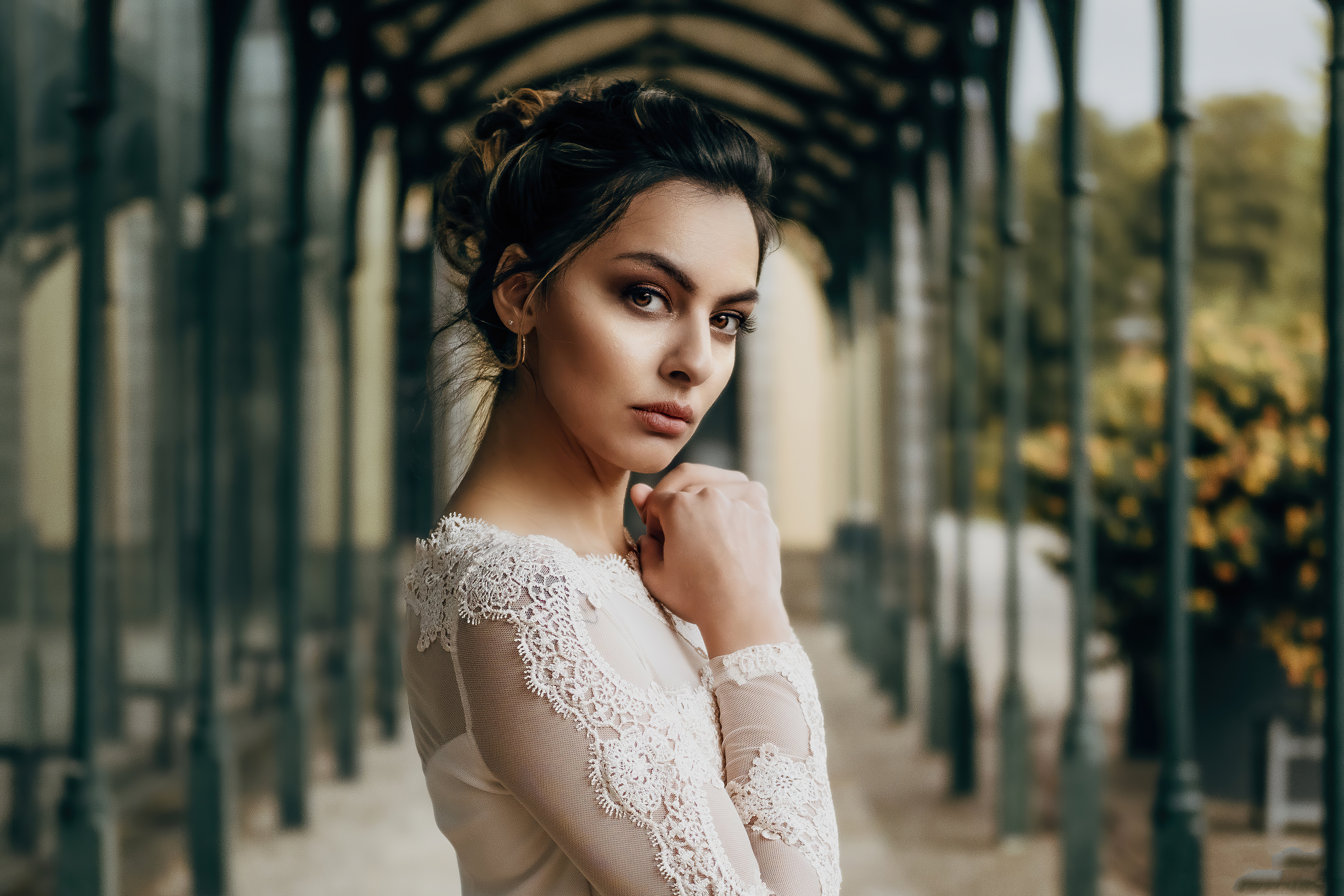 Woman in lace dress in a covered walkway HD Wallpaper
