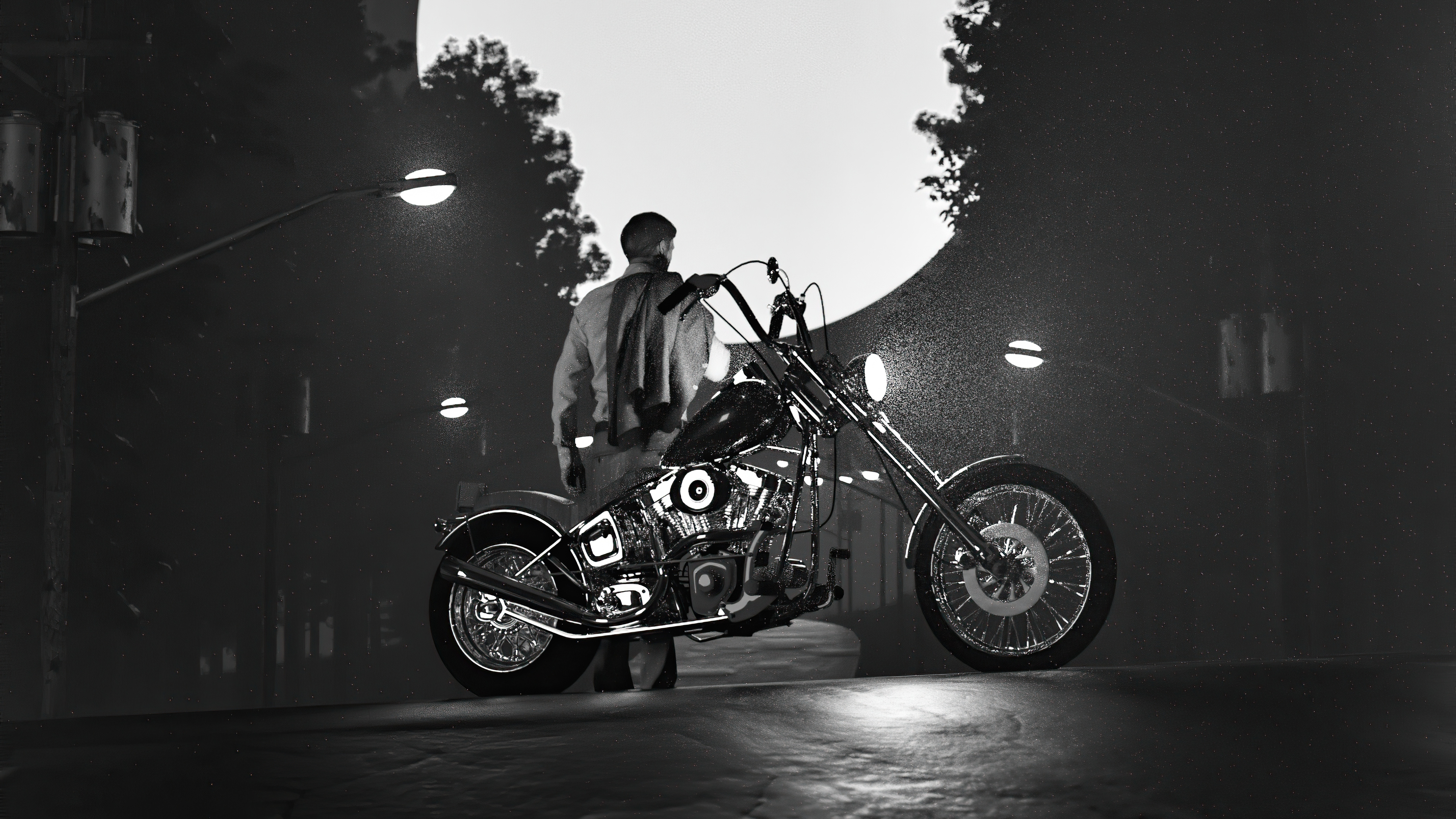 Man and motorcycle under a large moon HD Wallpaper