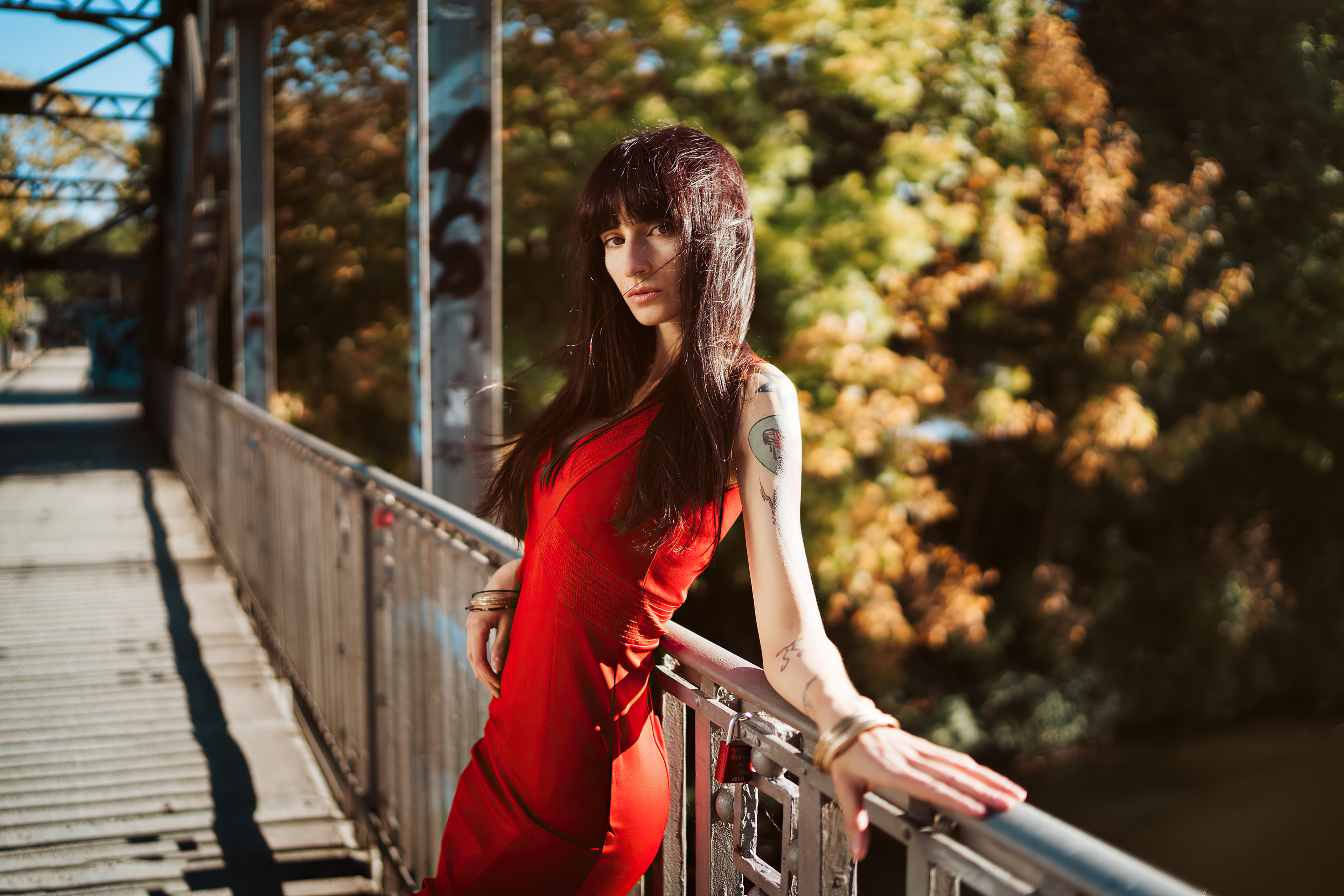 Woman with tattoos on a bridge HD Wallpaper