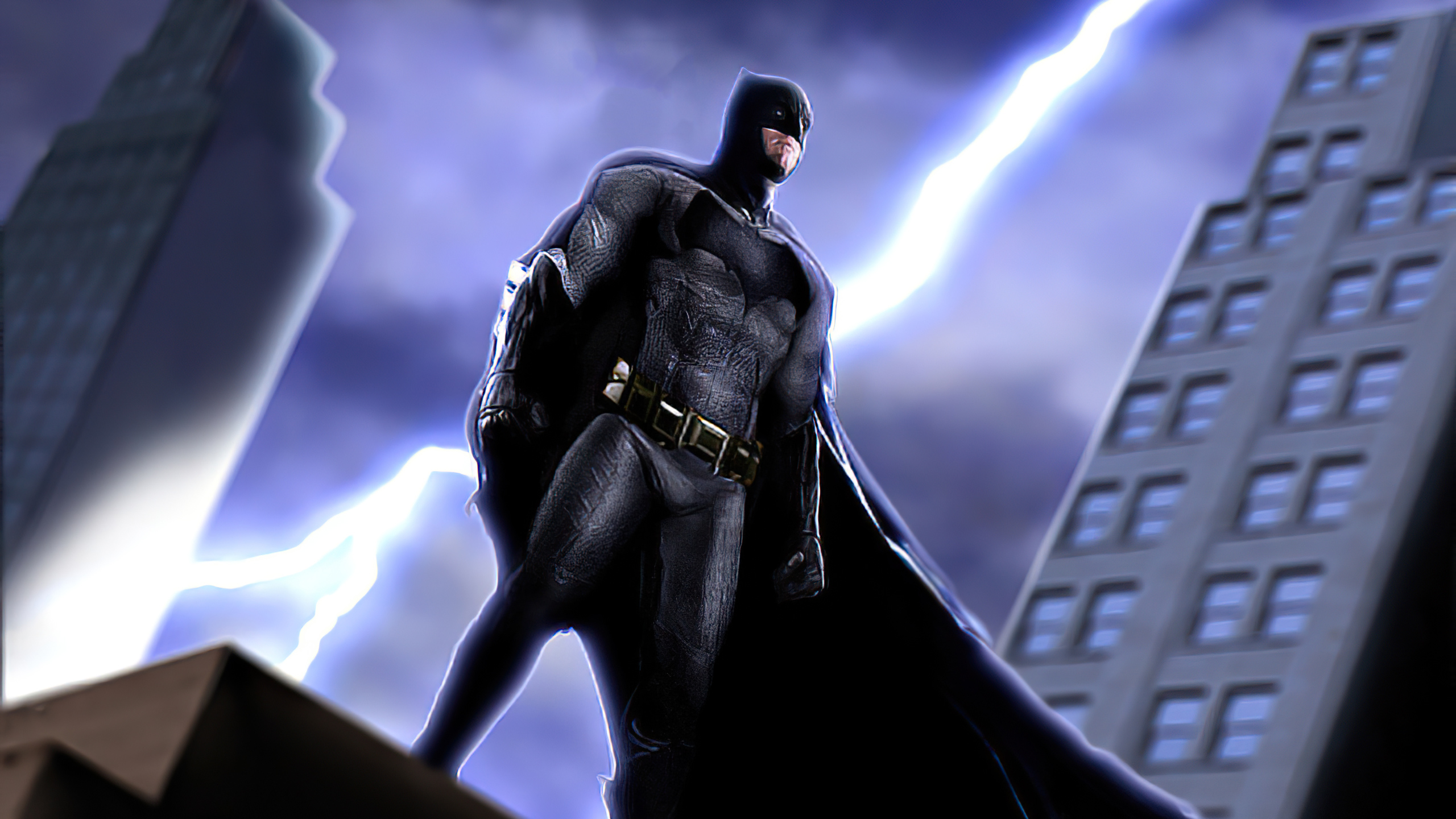 Batman standing on a rooftop during a lightning storm HD Wallpaper