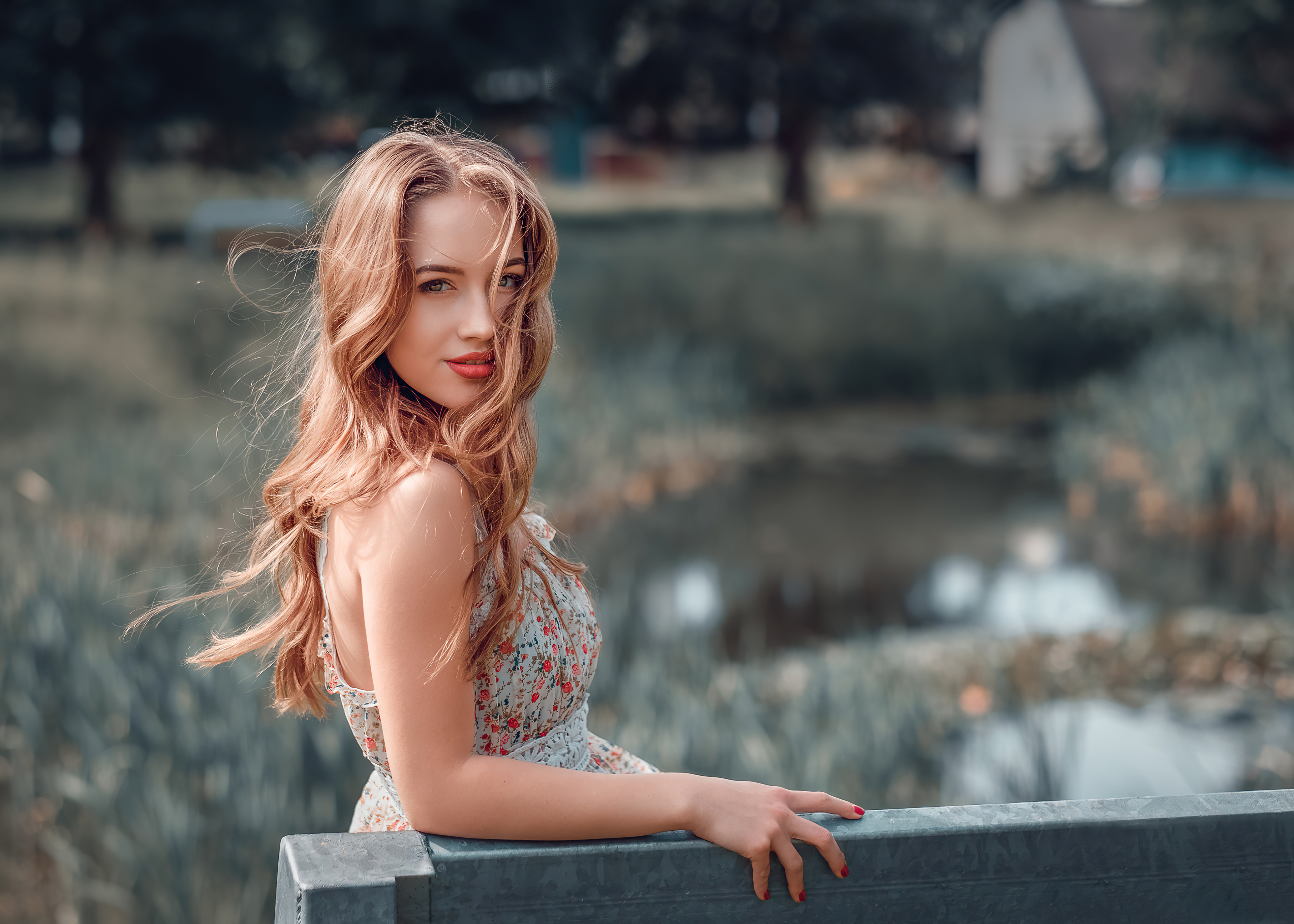 Woman with long wavy hair in a floral dress HD Wallpaper