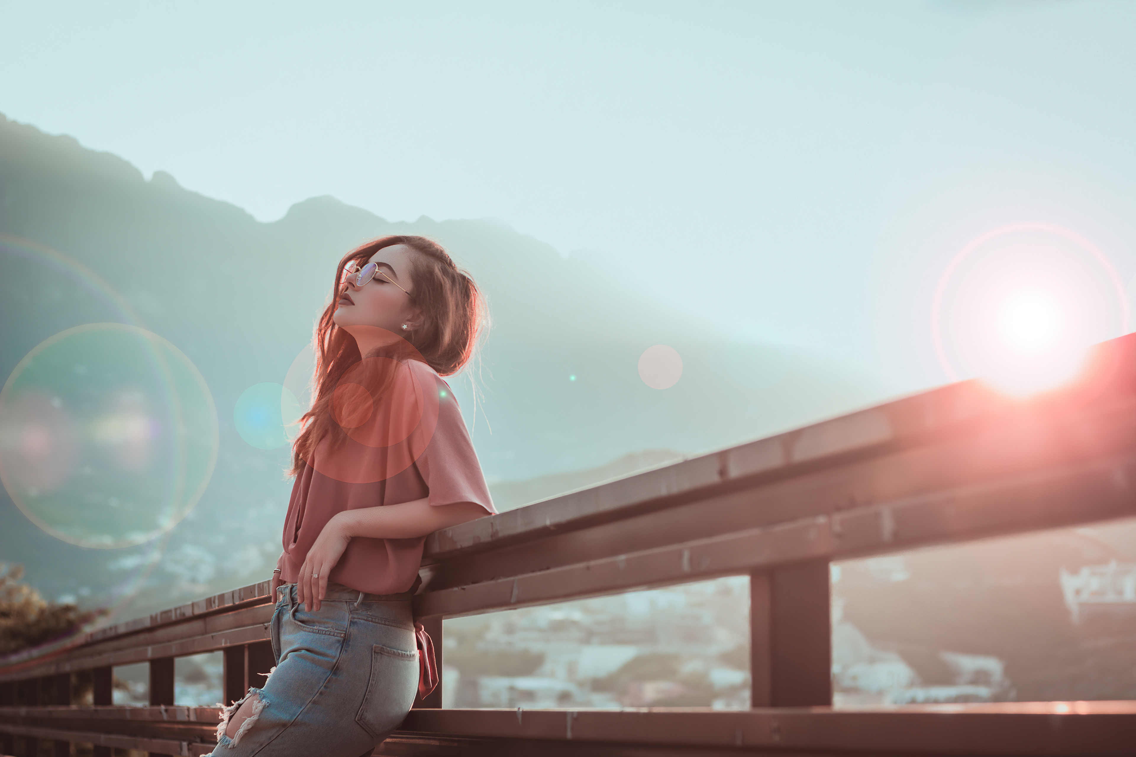 Girl wearing sunglasses leaning on a railing HD Wallpaper