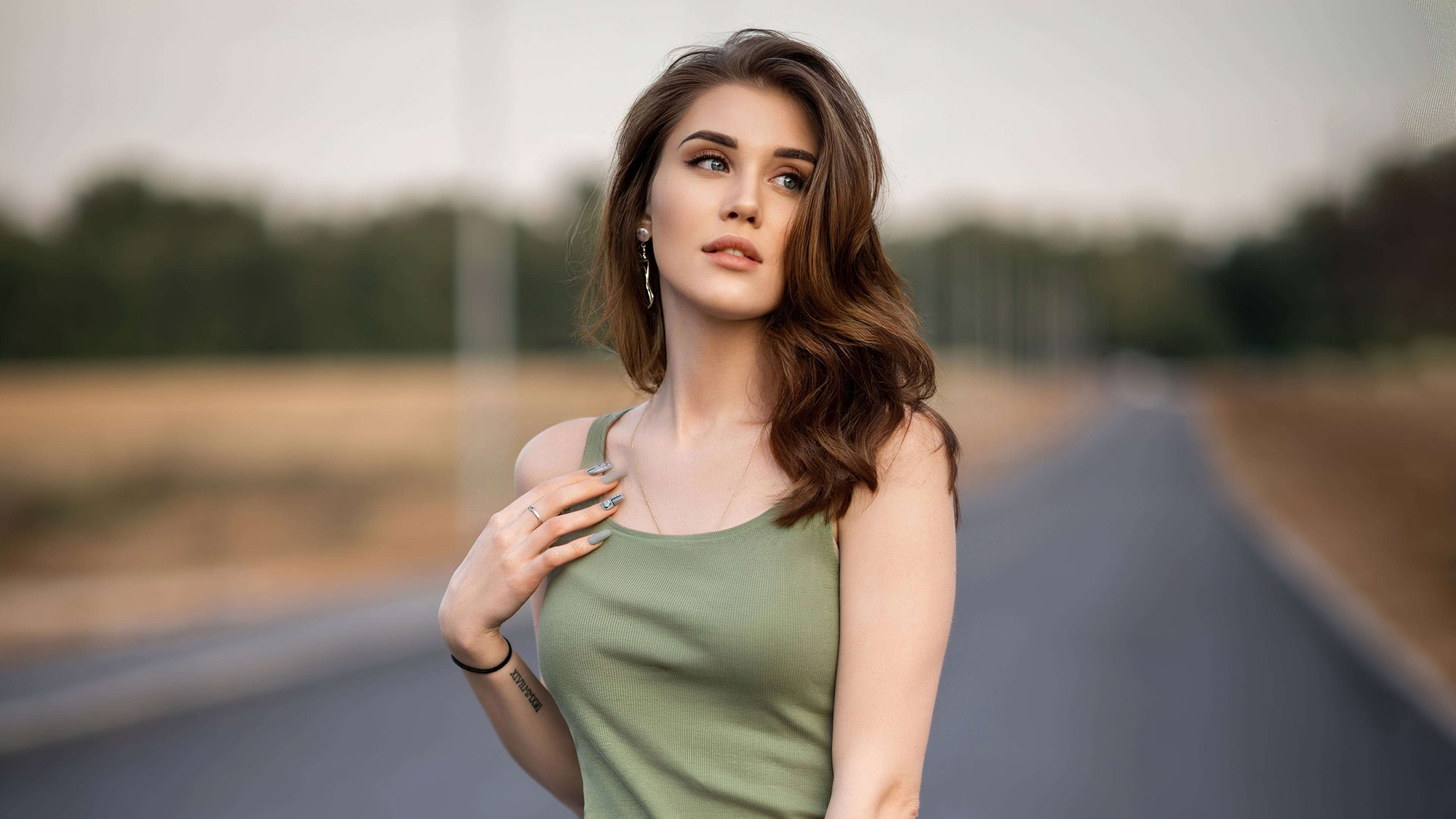 Woman in green tank top outdoors HD Wallpaper