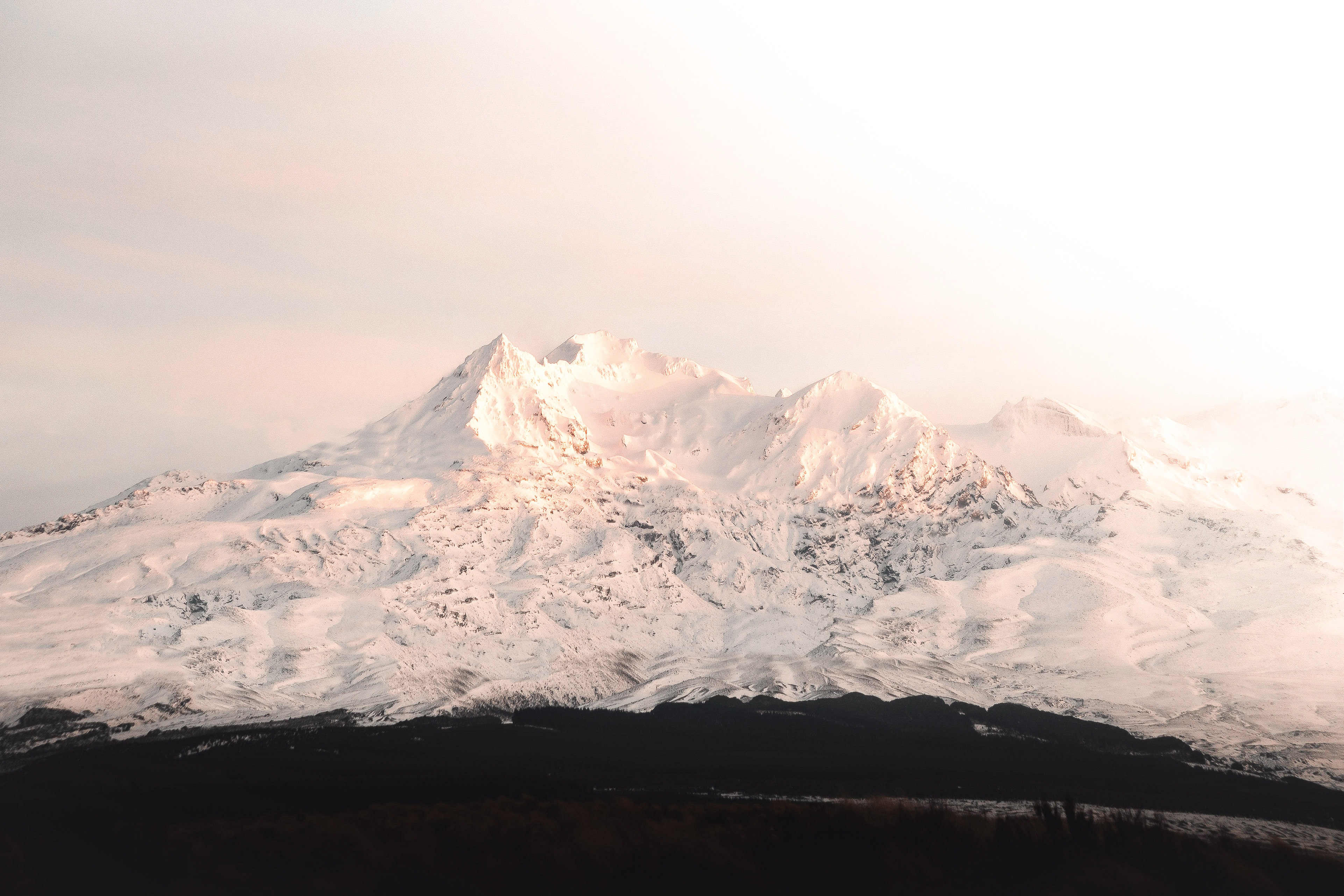 Snow covered mountains in soft light 4K HD Wallpaper