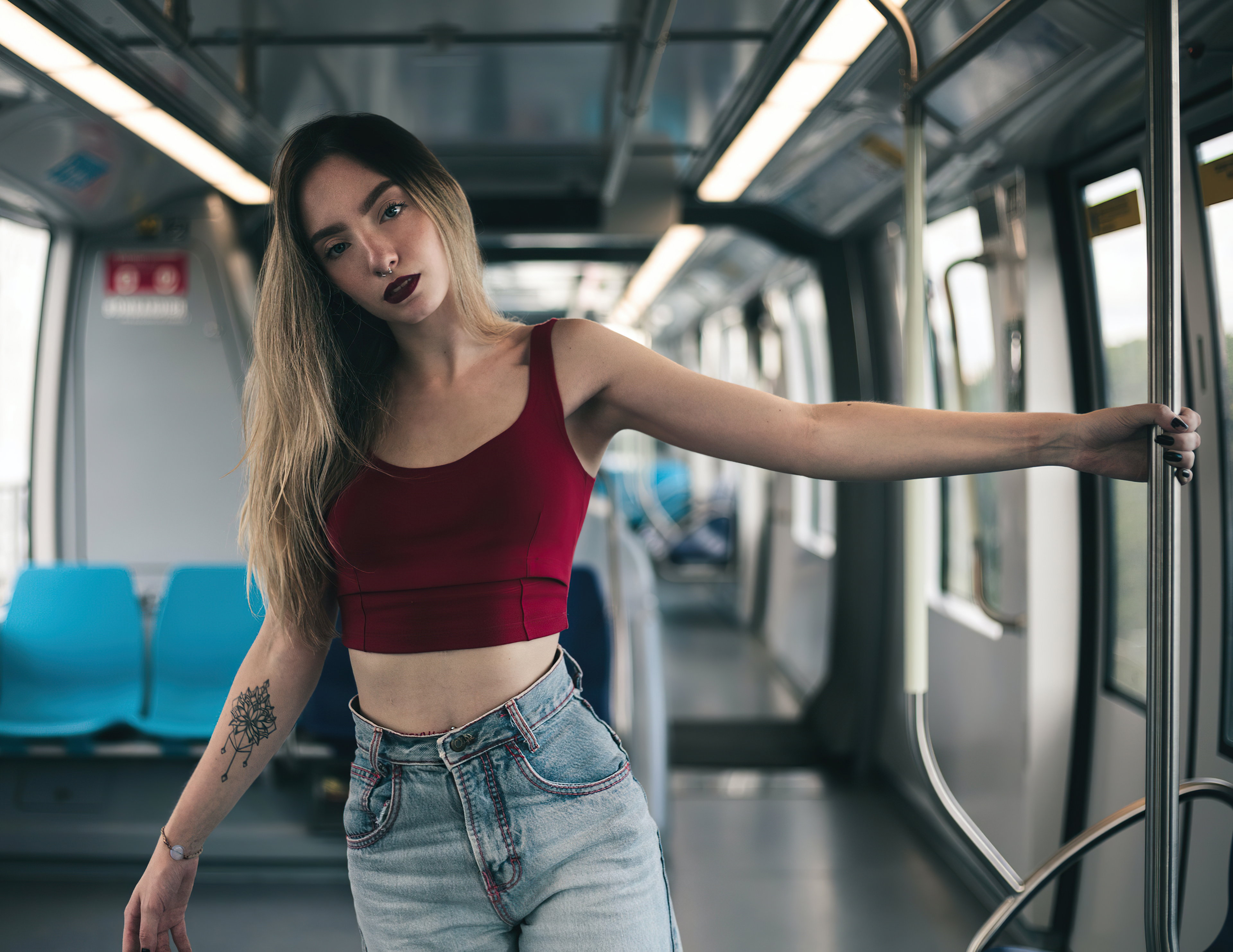 Woman posing in a subway car HD Wallpaper