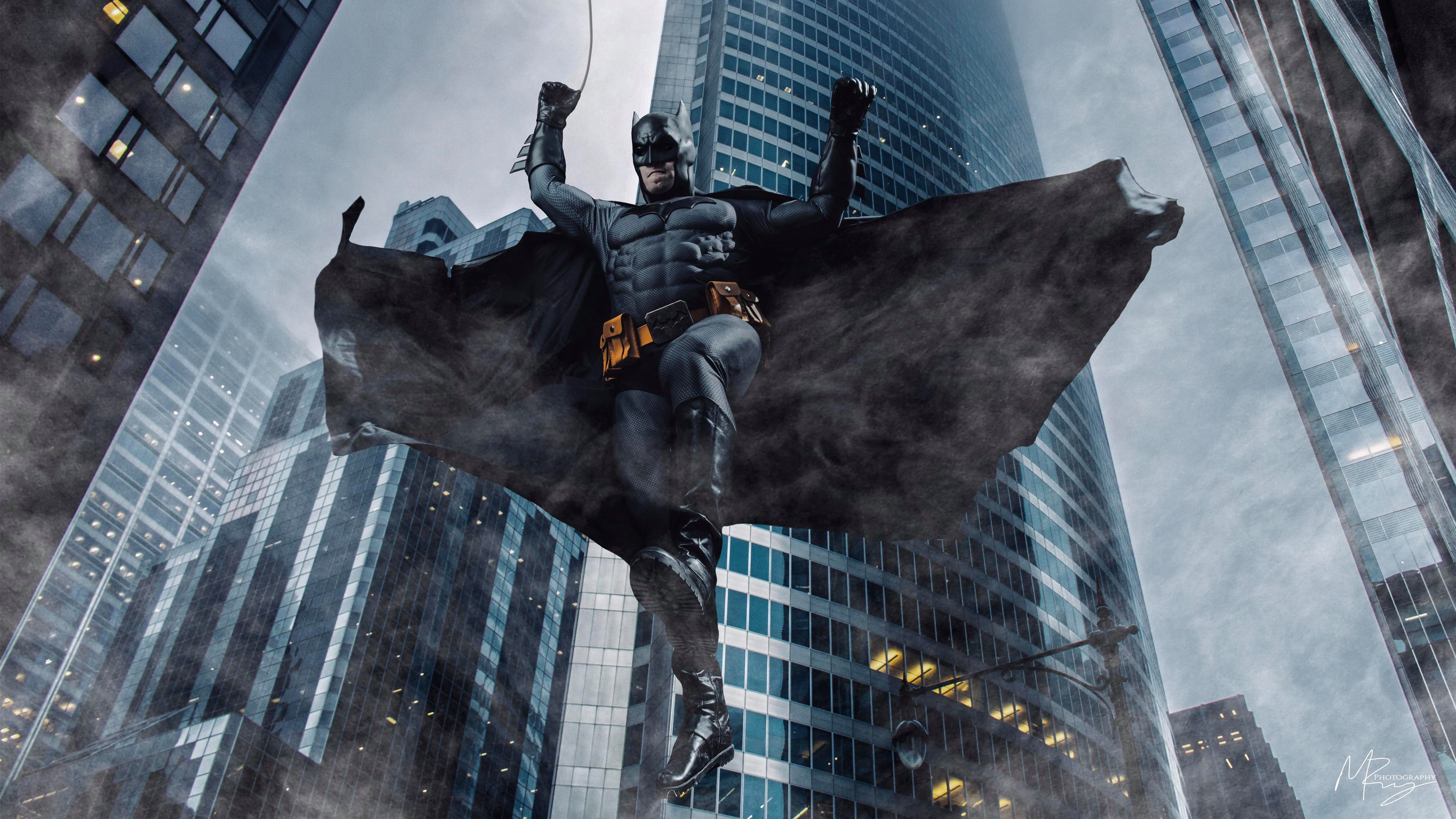 Batman cosplay in a city HD Wallpaper