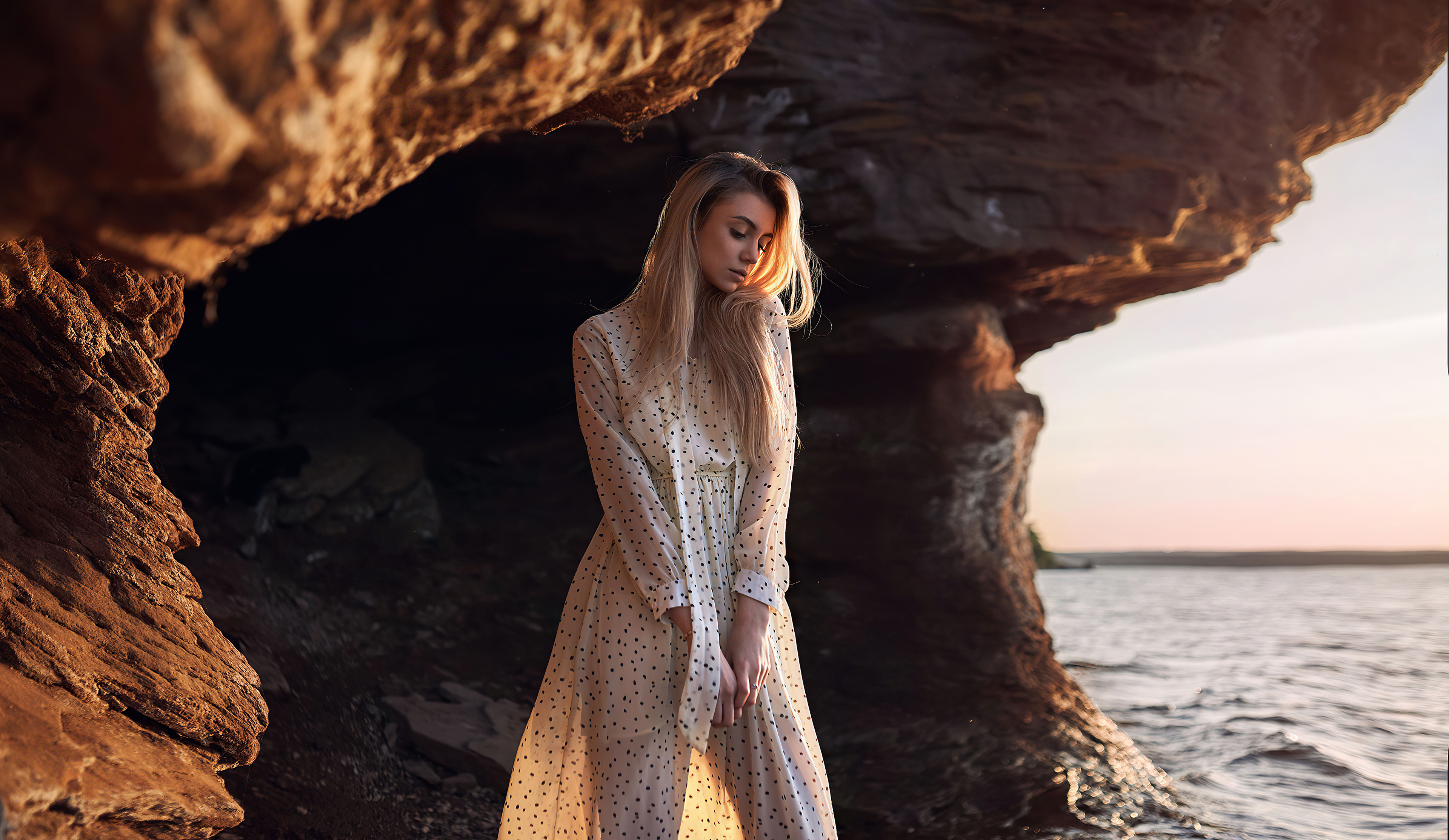 Model Portrait in Natural Cave Setting HD Wallpaper