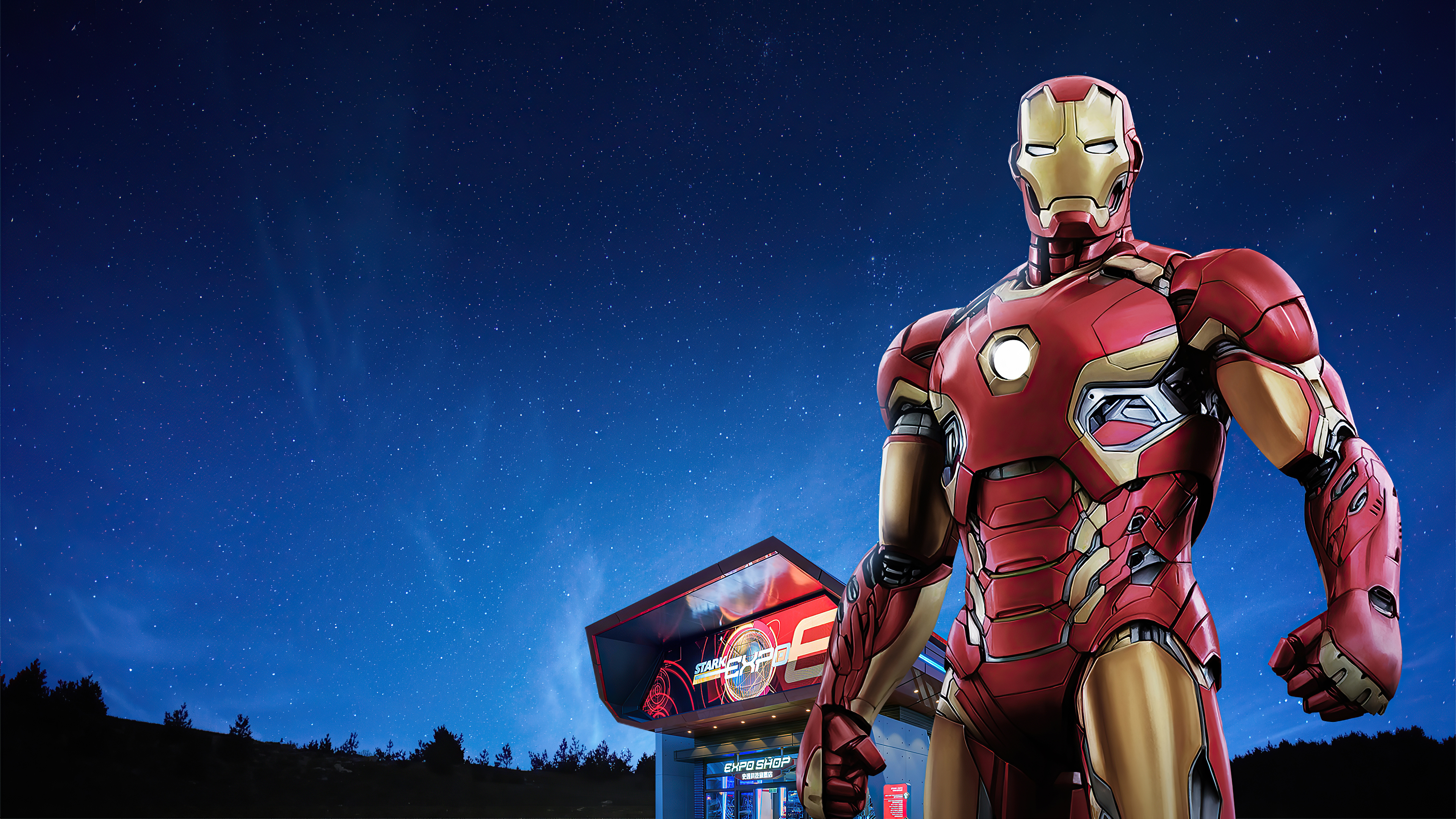 Iron Man in front of Stark Expo shop at night HD Wallpaper